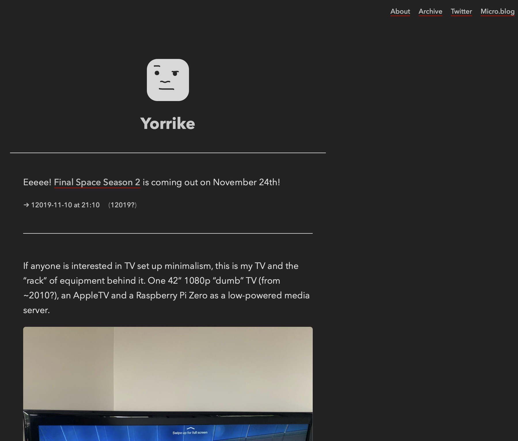 A screenshot of my website in dark mode - dark background with light text - links with a dark red underlline. 