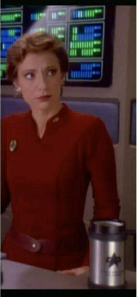 The character Kira Nerys witha gigsntic Starfleet travel mug. 