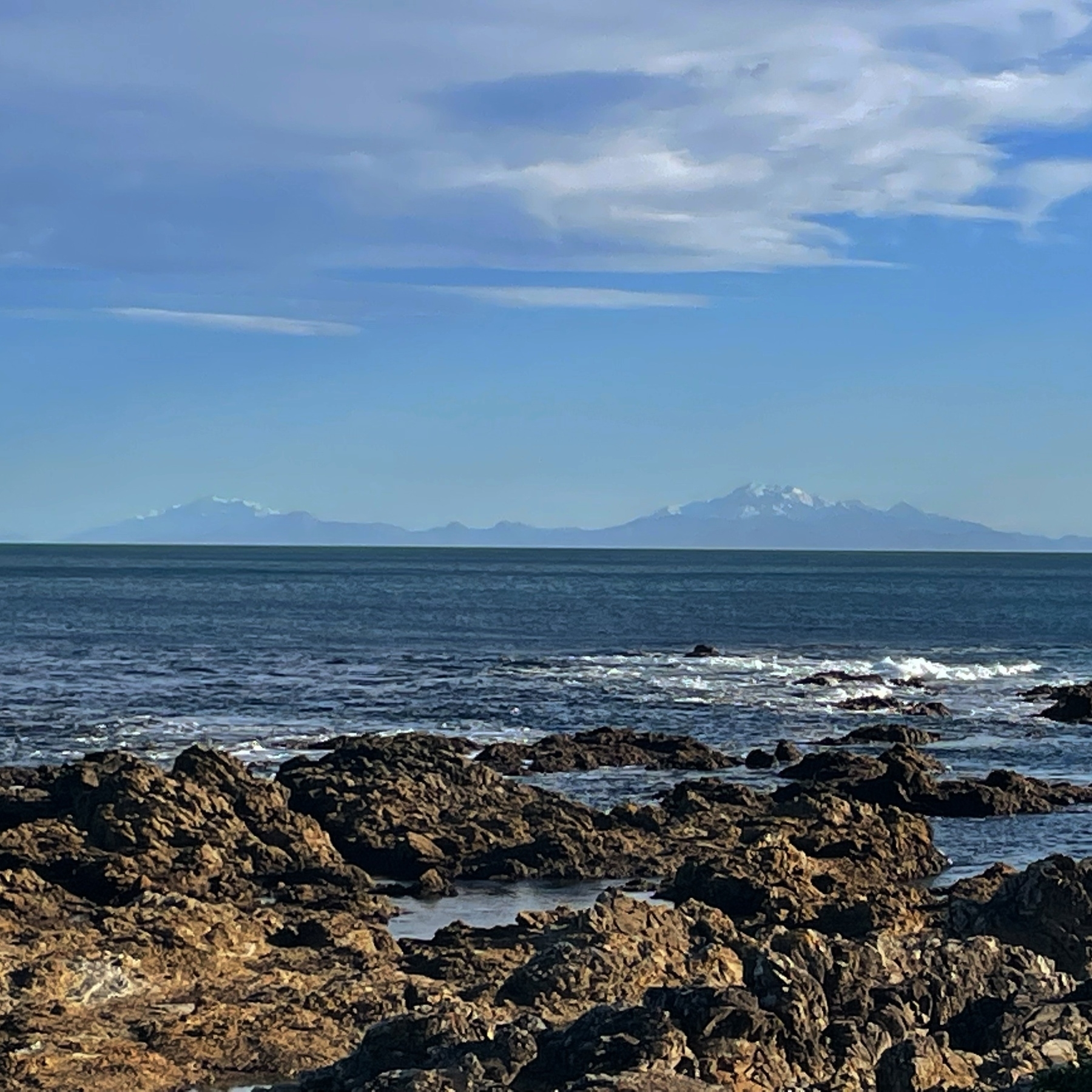 The mountains of the Kaikoura ranges, capped in snow, as seen from the southern Wellington coast