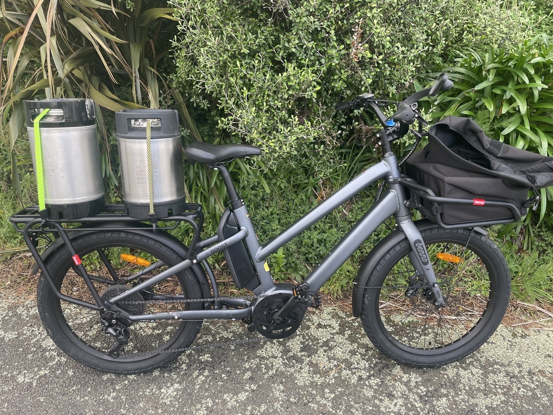 My dark grey step-through Benno Boost cargo eBike. On the rear rack are two beer kegs. The front rack has my front basket bag which holds a week’s shopping. It is a normal shaped bike with slightly smaller wheels so although it is long, it fits in places most normal bikes would. 