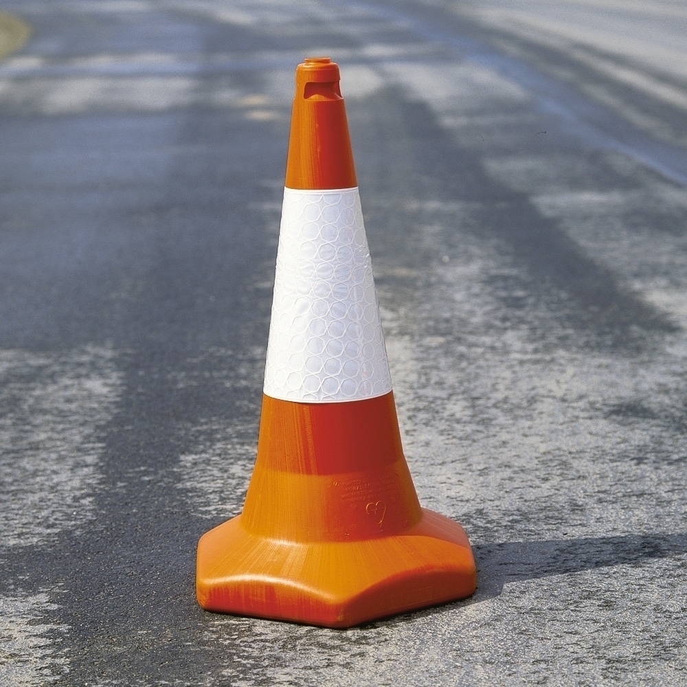 A picture of one of those, normally orange, cone-shaped objects used to manage traffic on a temporary basis. 