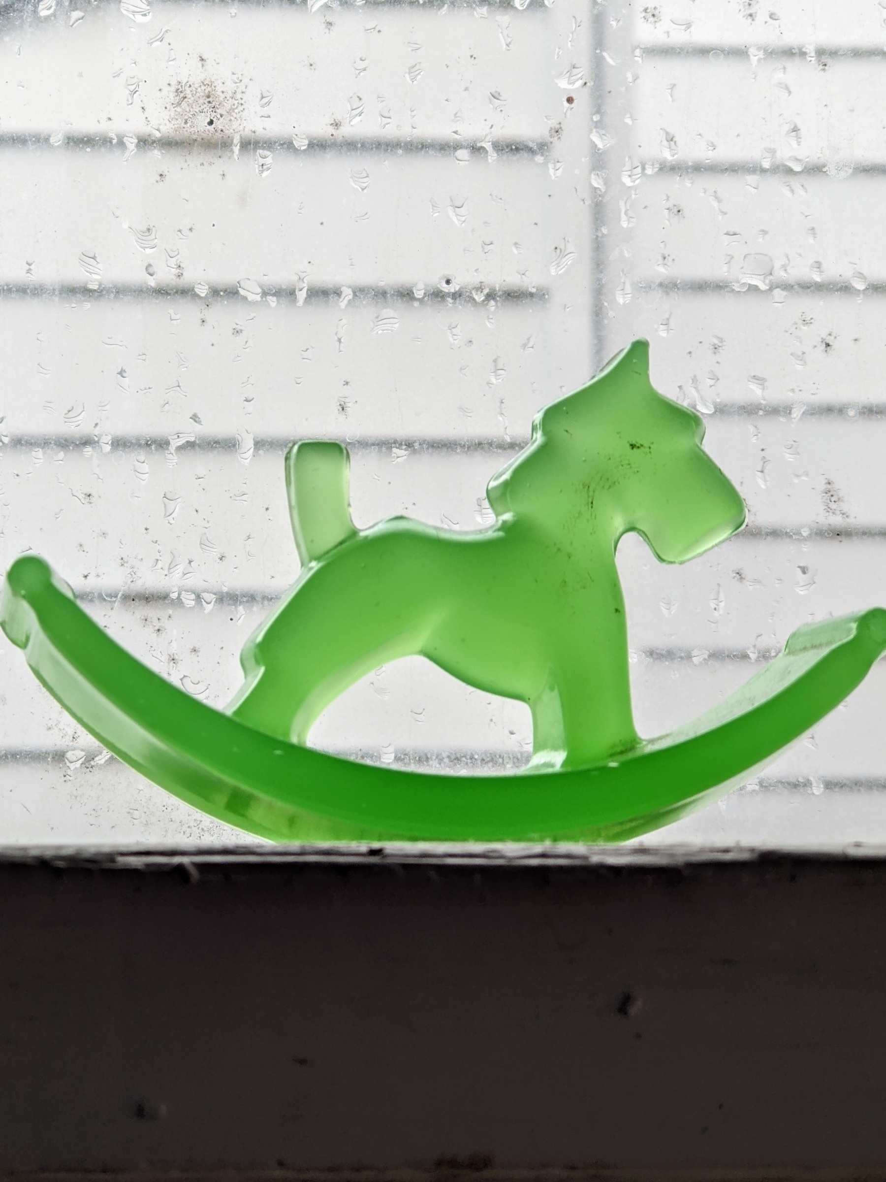 green glass rocker blotter with a figure of a Scottie dog as the rocker handle