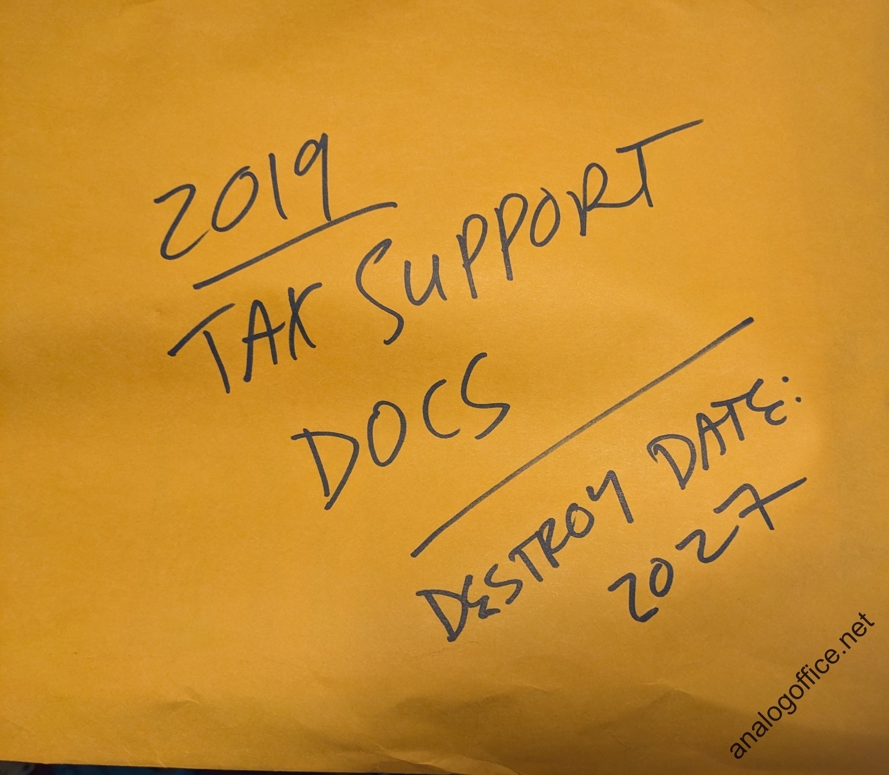 manila envelope labeled, 2019 tax support documents, destroy date 2027
