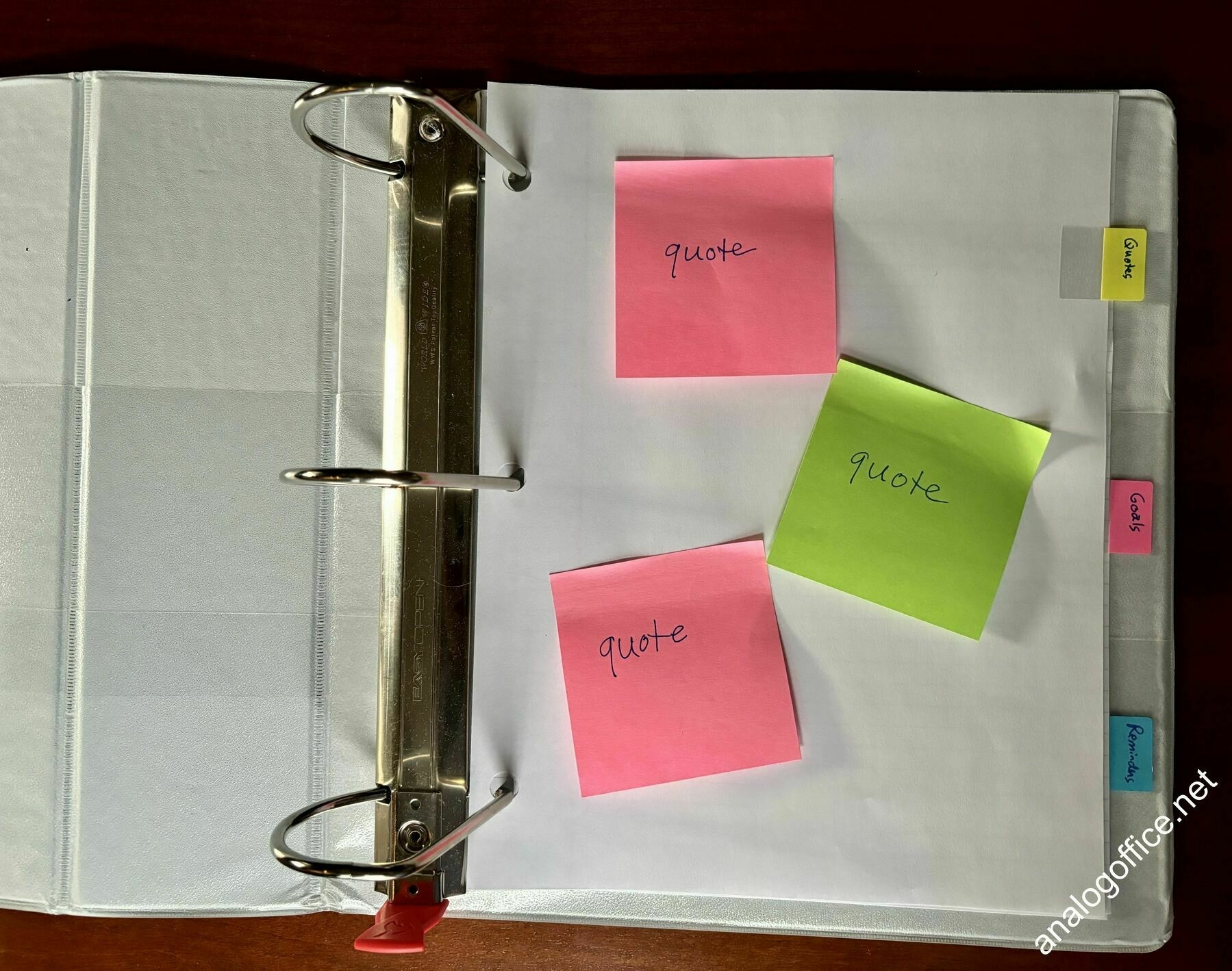 sticky notes in a three-ring binder