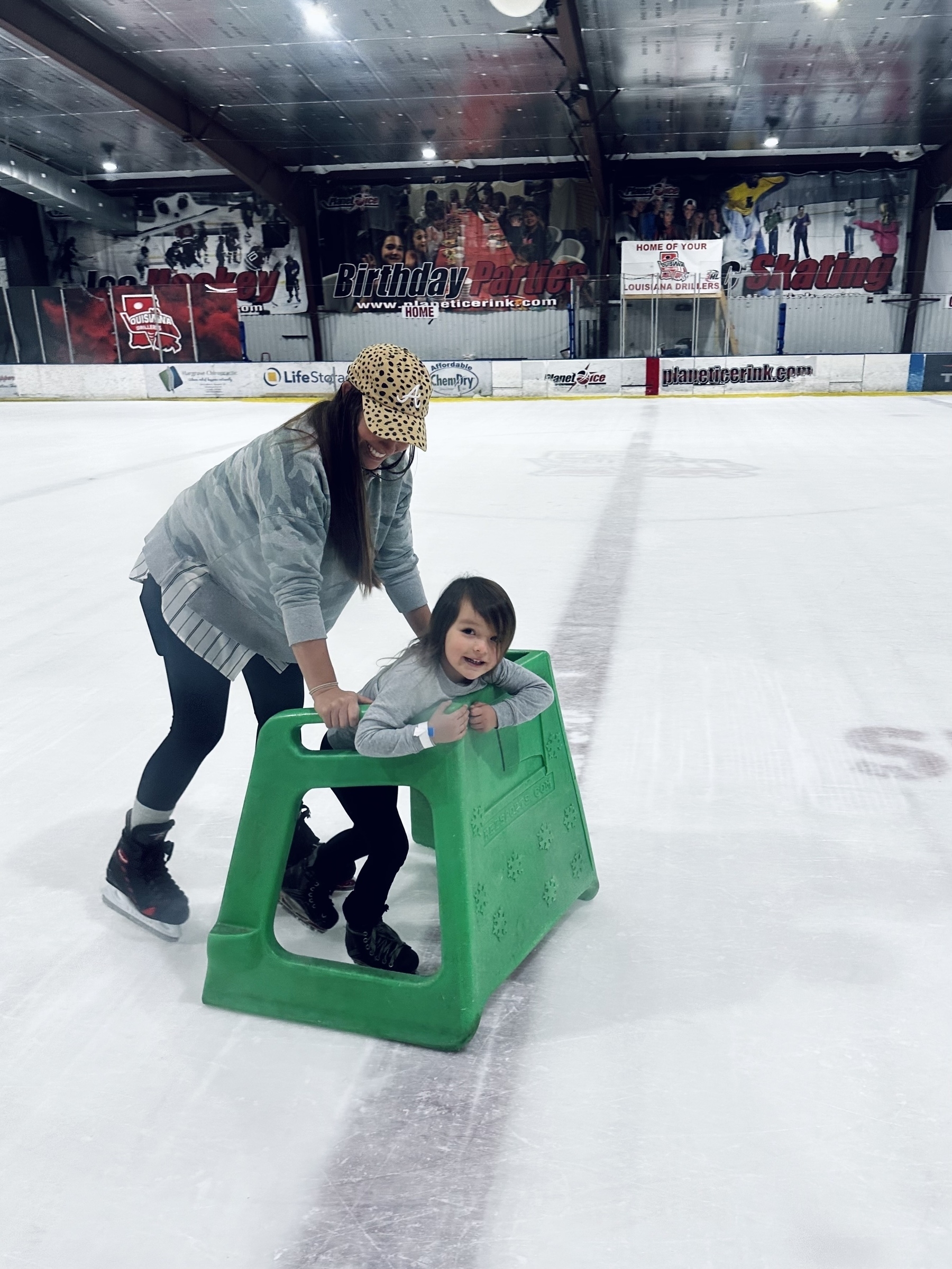 Mom and 4 year old ice skating.