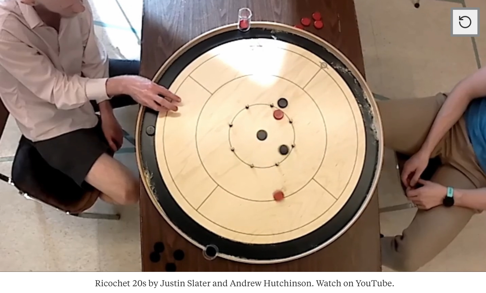 Overhead shot of a crokinole game with ricochet 20s by Justin Slater and Andrew Hutchinson