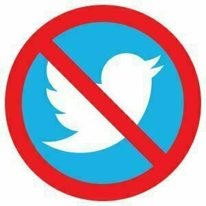 The Twitter bird crossed out like a road sign.