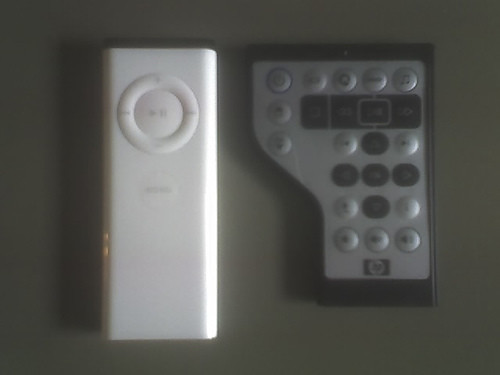 An image of a remote from Apple and a PC