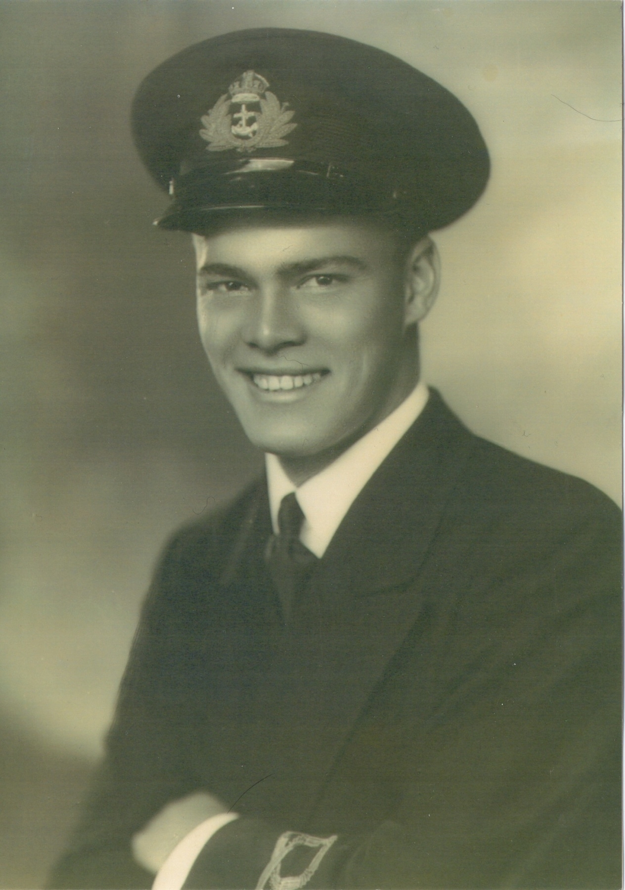 A portrait photo of my grandfather as a young man in a navy uniform