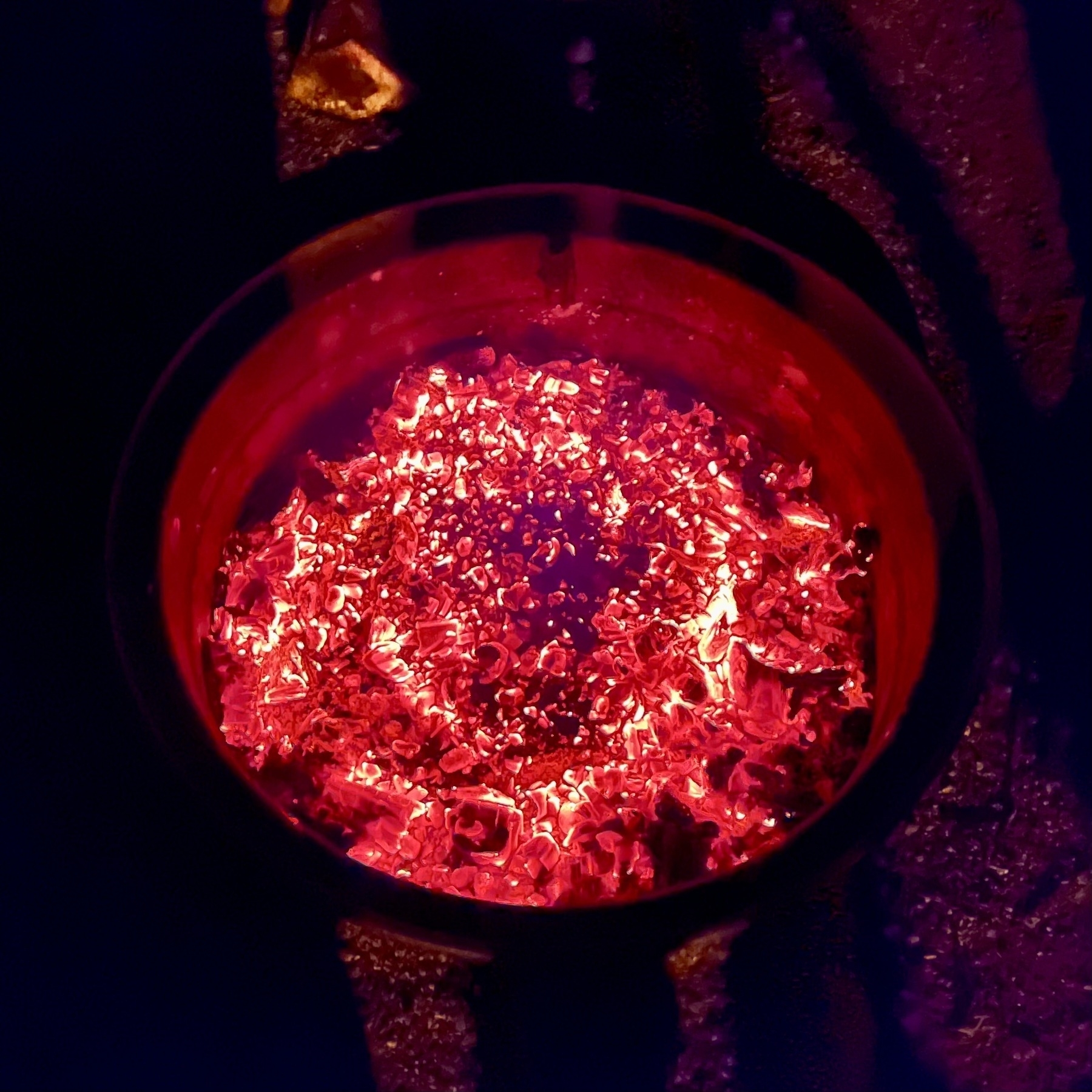 Red hot coals in a fire pit