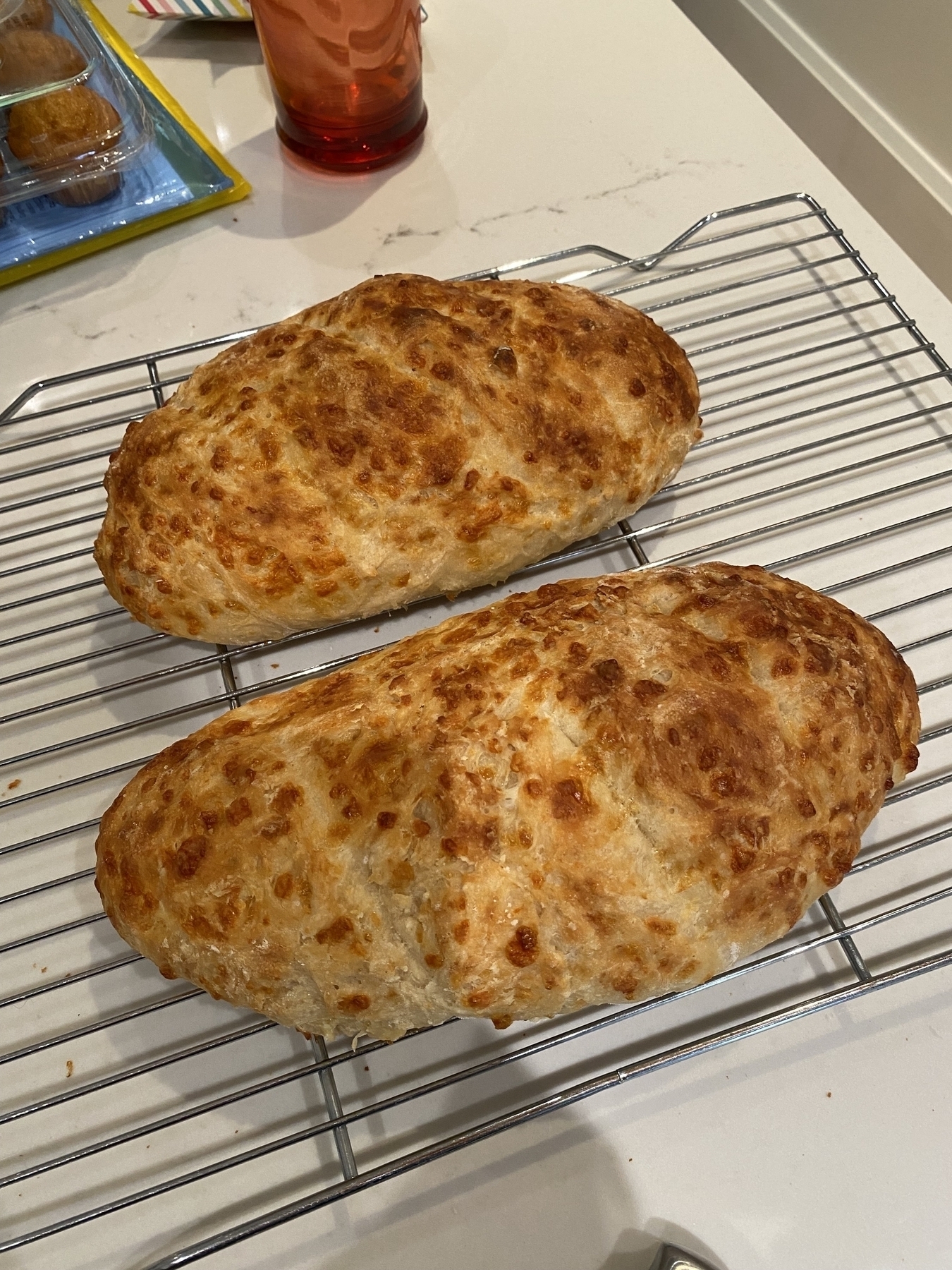 Two whole loaves of cheese bread