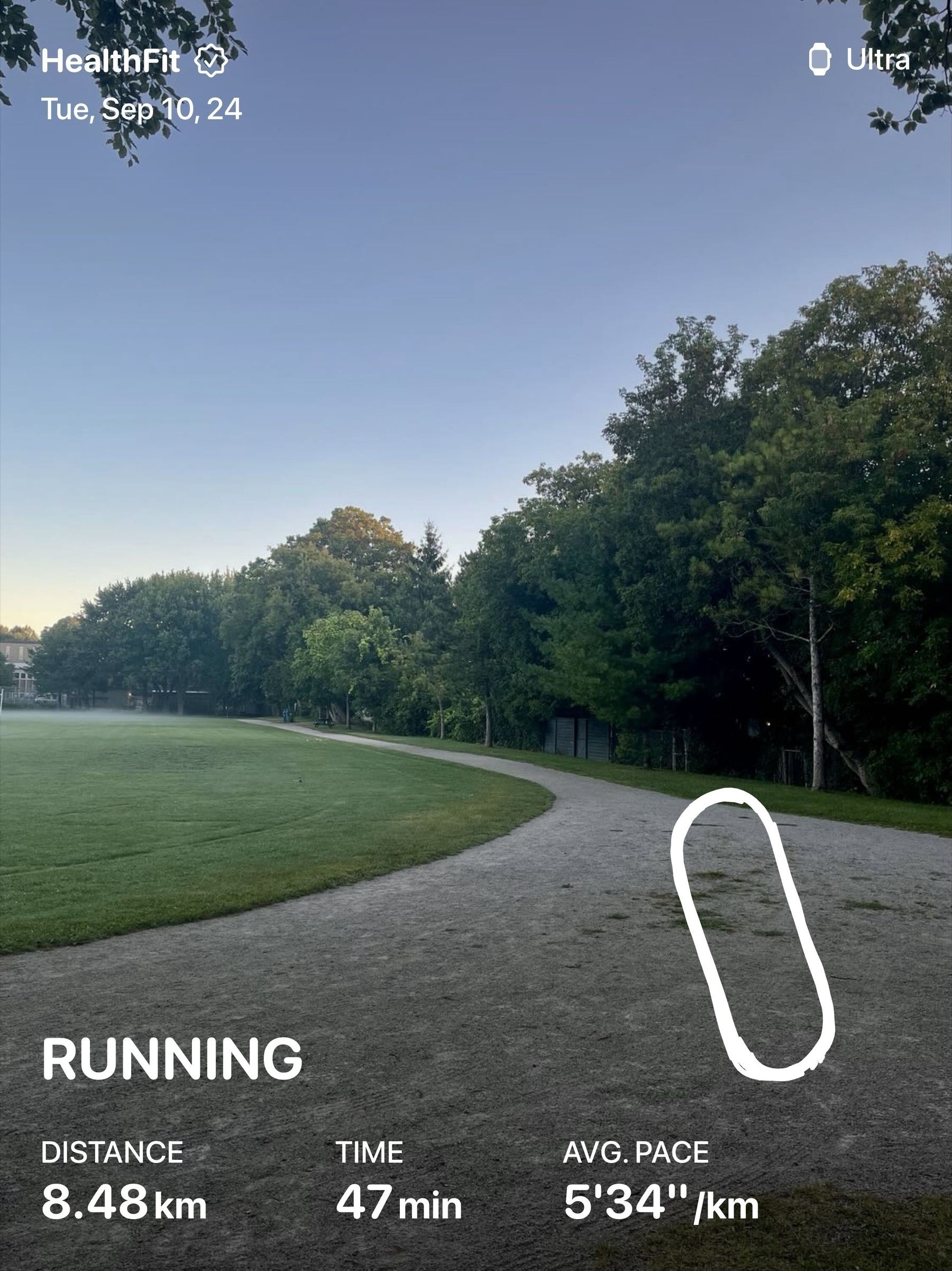 A running app screenshot shows a track path bordered by green trees under a clear sky.