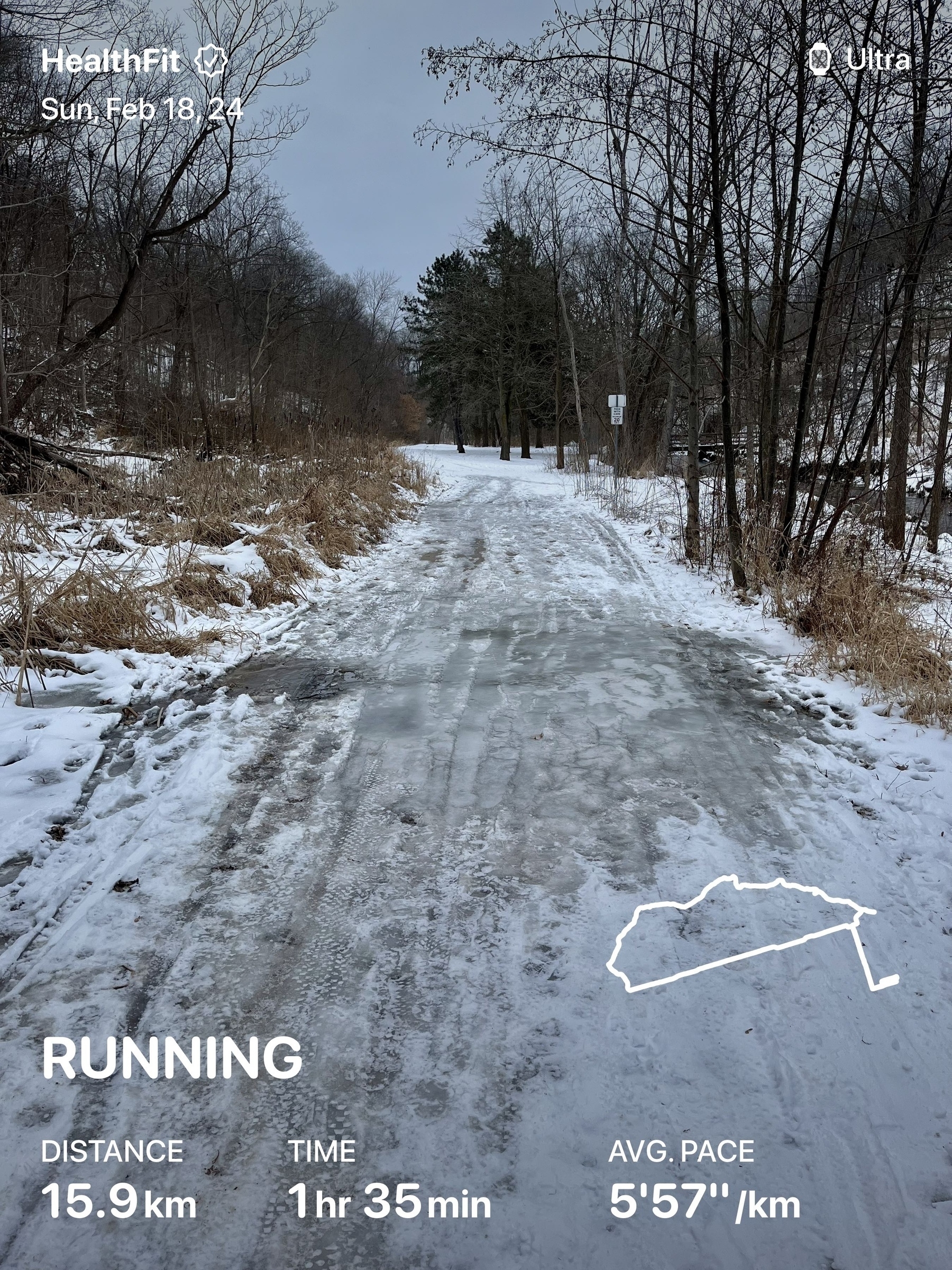 Icy and snow trail. Overlaid with run stats: 16km in 1.5 hours