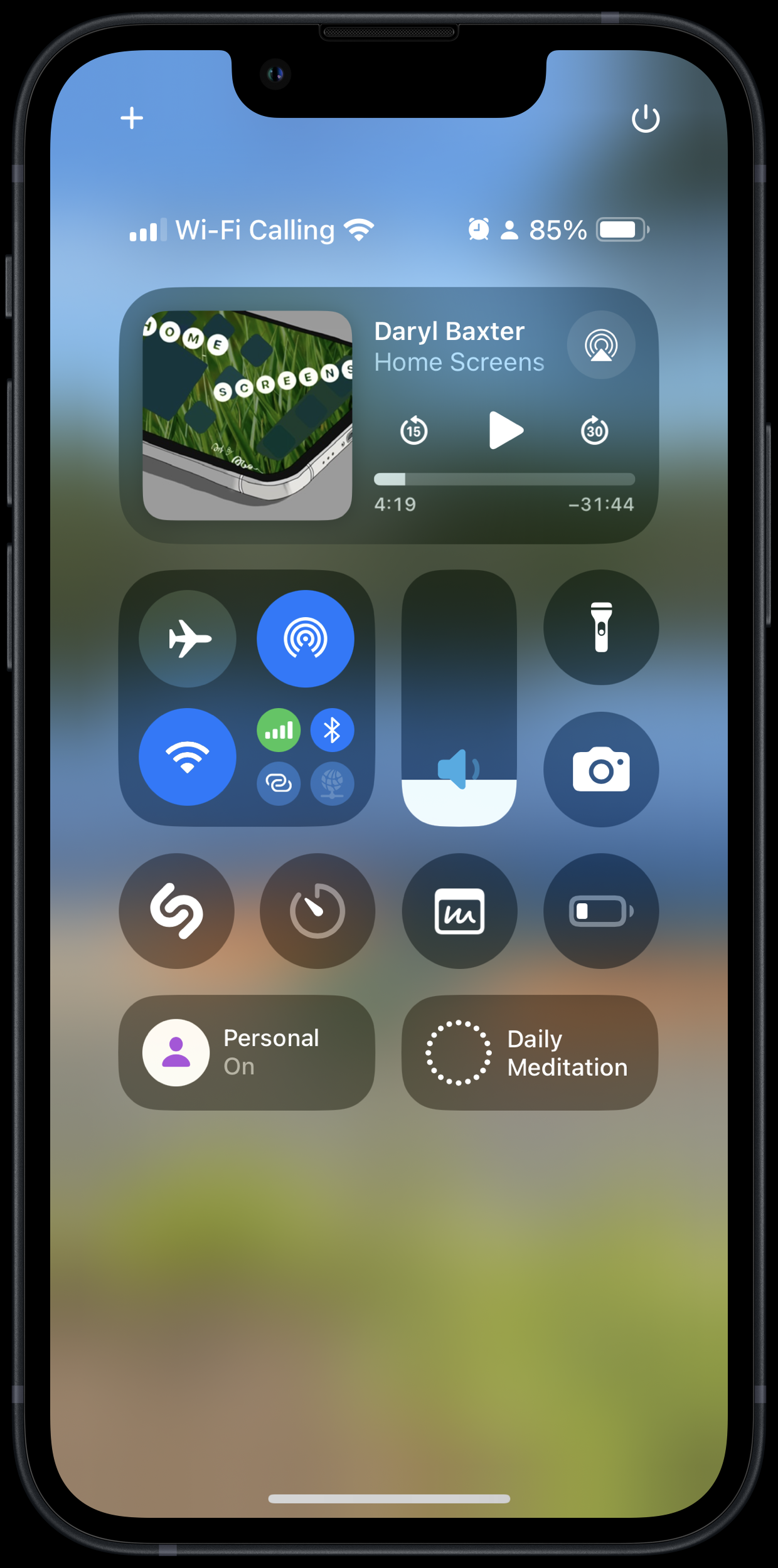 Auto-generated description: A smartphone screen displaying the Control Center with various icons and settings, including a media player for a podcast episode titled Home Screens by Daryl Baxter.