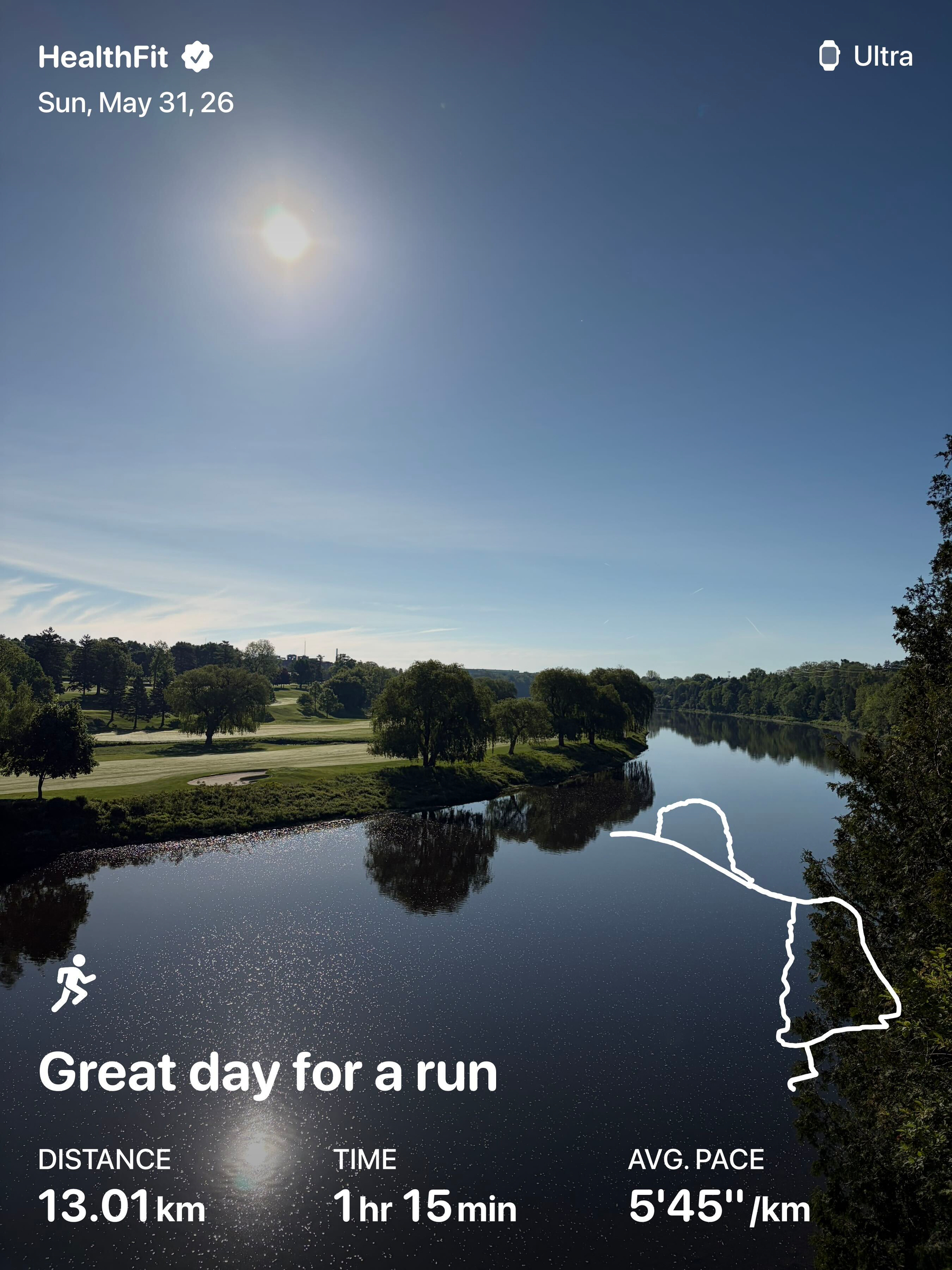 A sunny landscape featuring a river, trees, and a golf course is overlaid with running stats proclaiming Great day for a run.