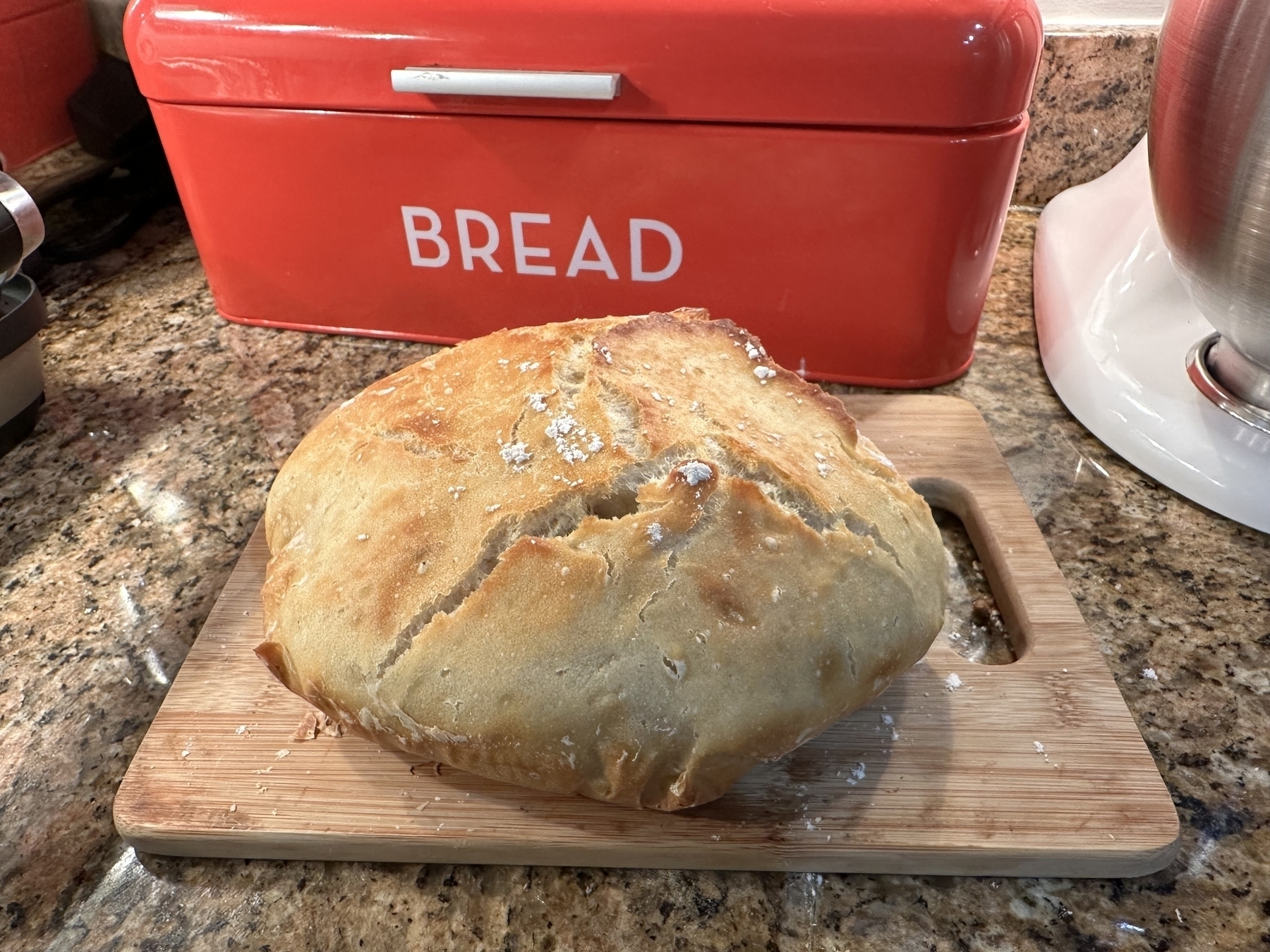 Photo of a misshapen bread loaf on a kitchen counter.