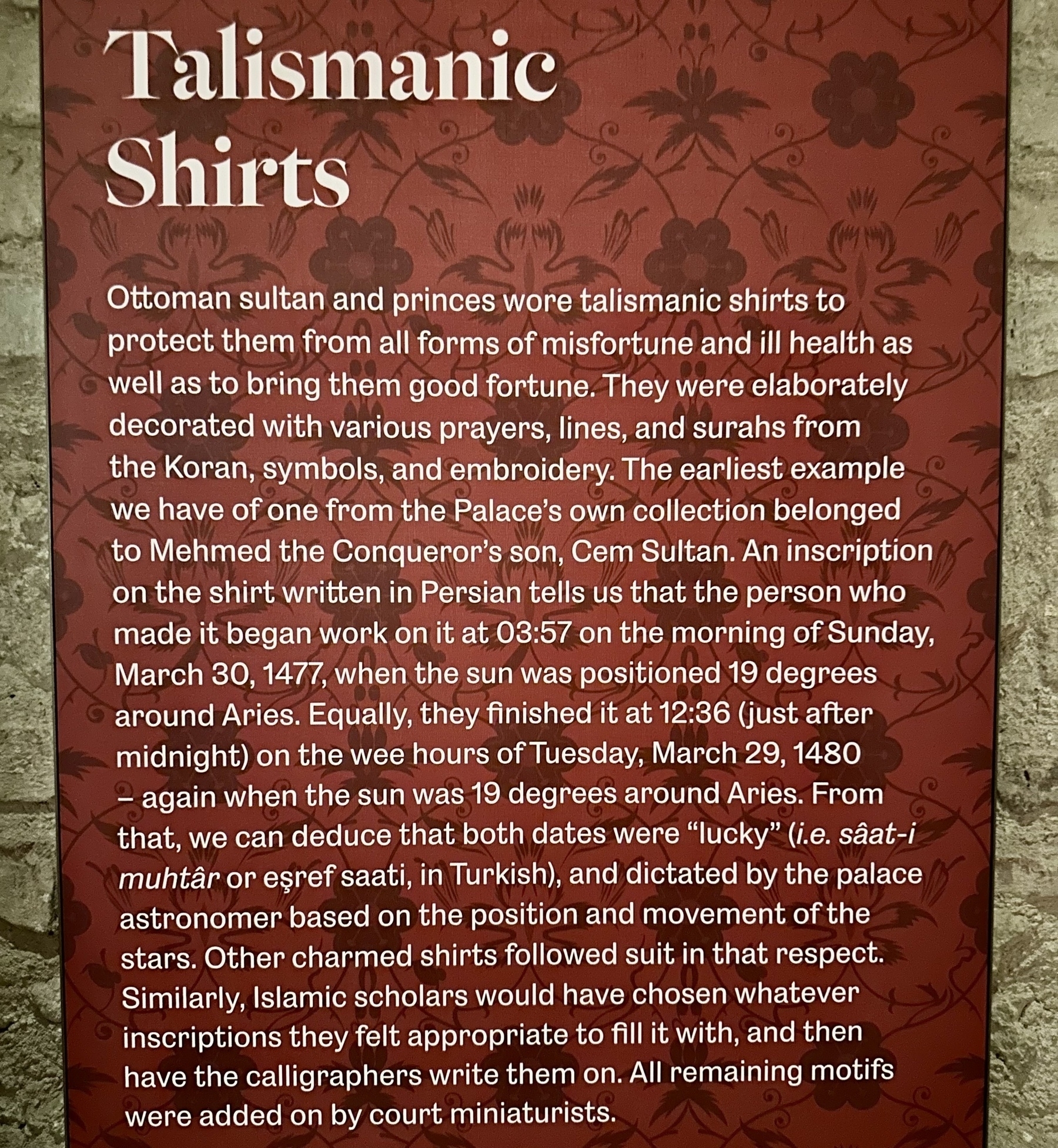 A detailed poster explains the historical significance and details of talismanic shirts worn by Ottoman sultans and princes for protection against misfortune and illness, including astrological correlations and inscriptions from the collection of Mehmet the Conqueror's son, Cem Sultan.