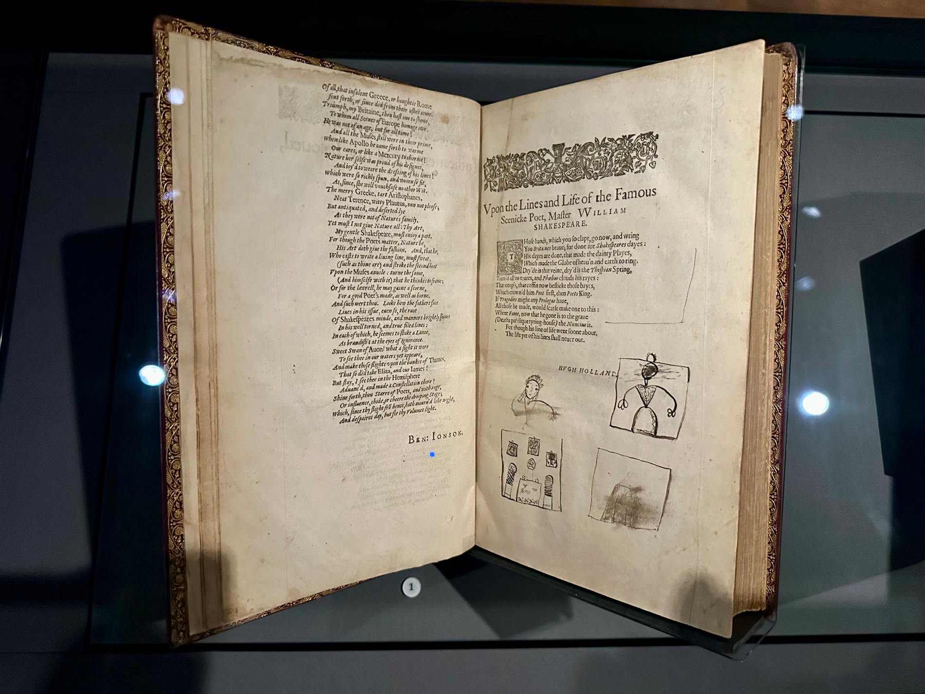 An illuminated manuscript is displayed, open to two pages featuring textual and illustrative content.