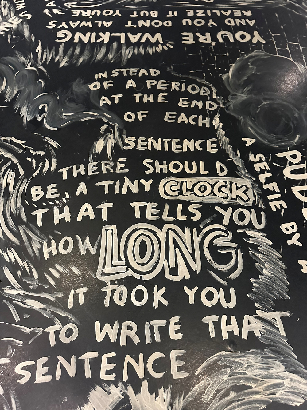 A black and white artwork features handwritten text suggesting a tiny clock should be at the end of each sentence to show how long it took to write.