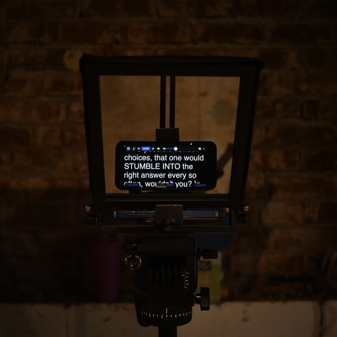 A picture of a teleprompter in a basement. The text is a fragment of the Brennan Lee Mulligan rant from the Game Changer episode Yes or No