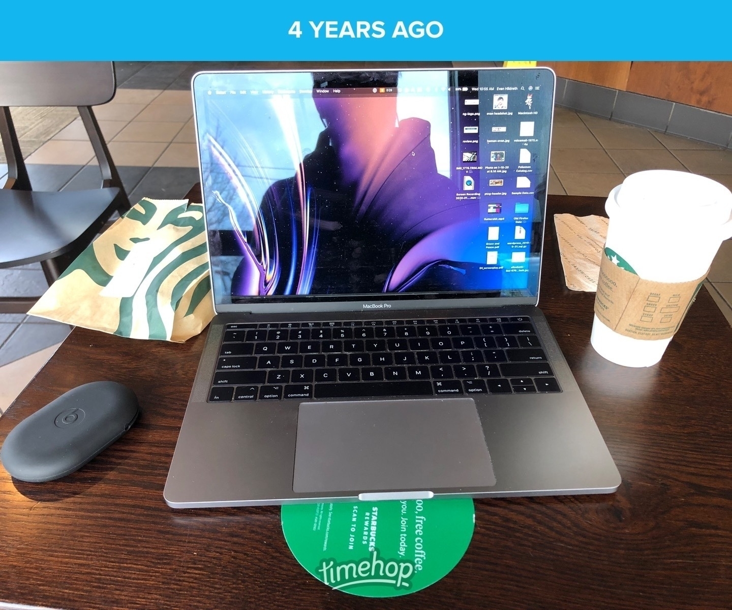 A picture of a laptop on a Starbucks table, a drink on one side and a pastry on the other. Captioned “4 years ago”