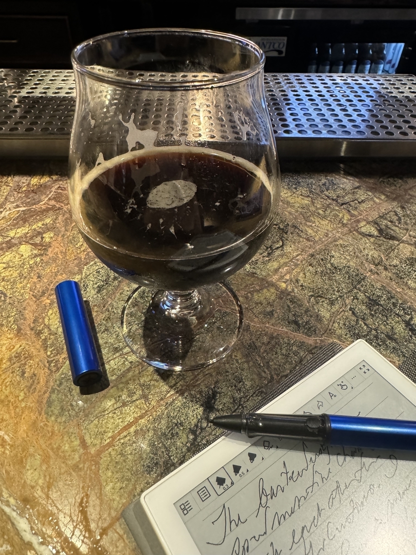 Beer and writing implements. 
