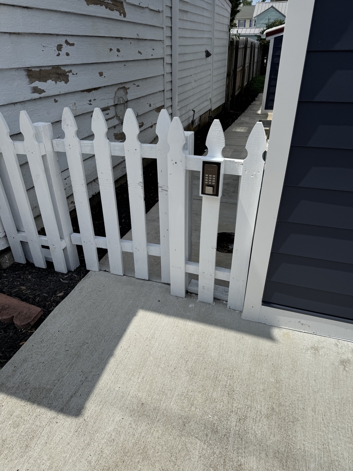 Electronic lock on a 3ft high picket fence to a small back yard. 