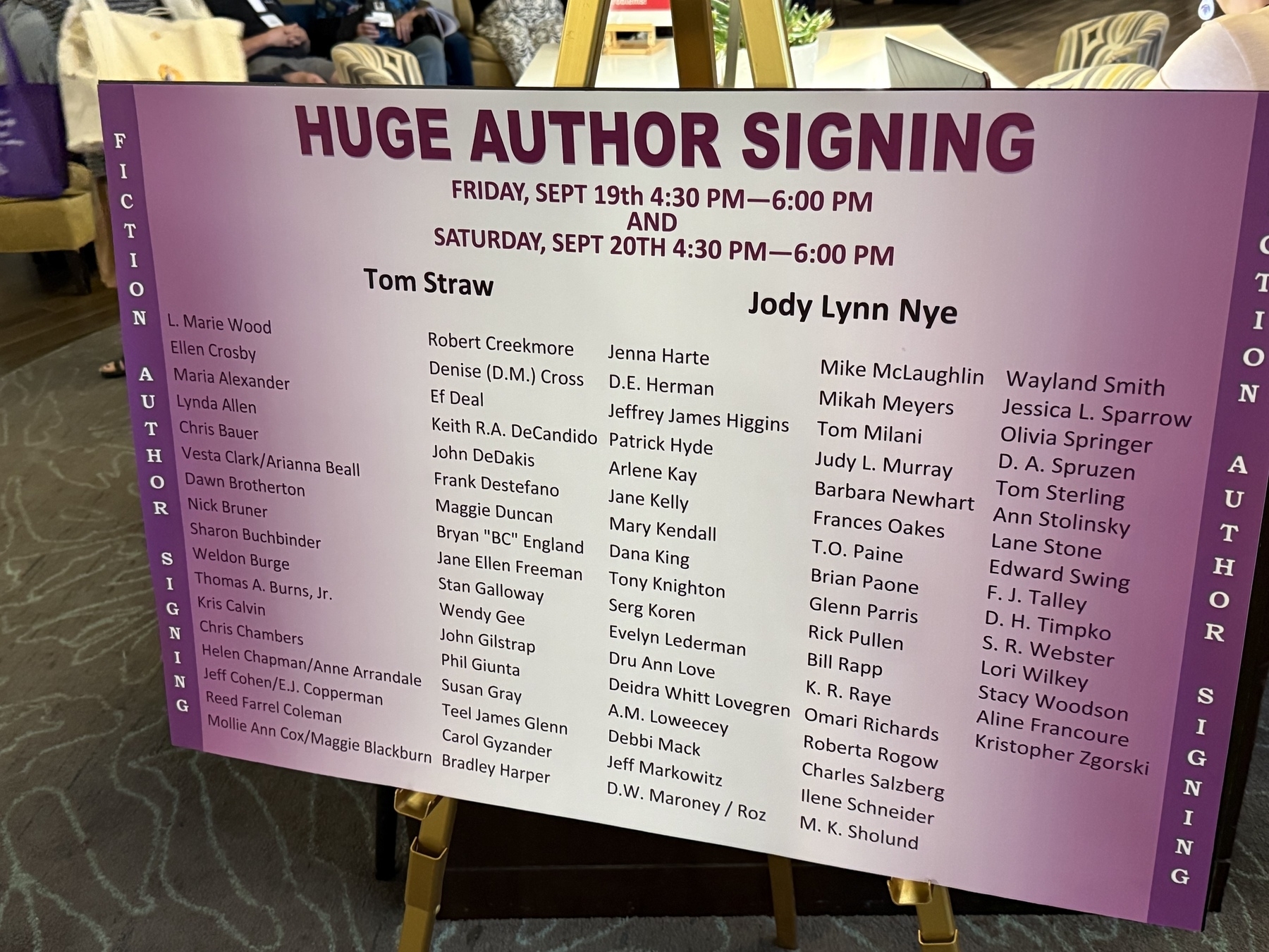 Author signing poster 