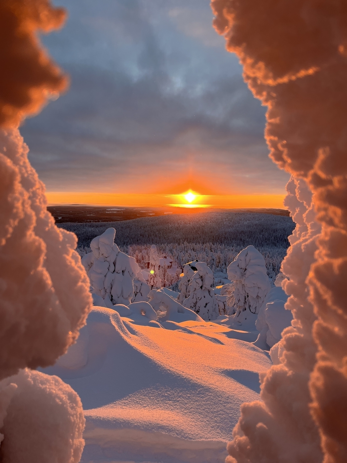 Iso-Syöte sunset sht between a hole in snow