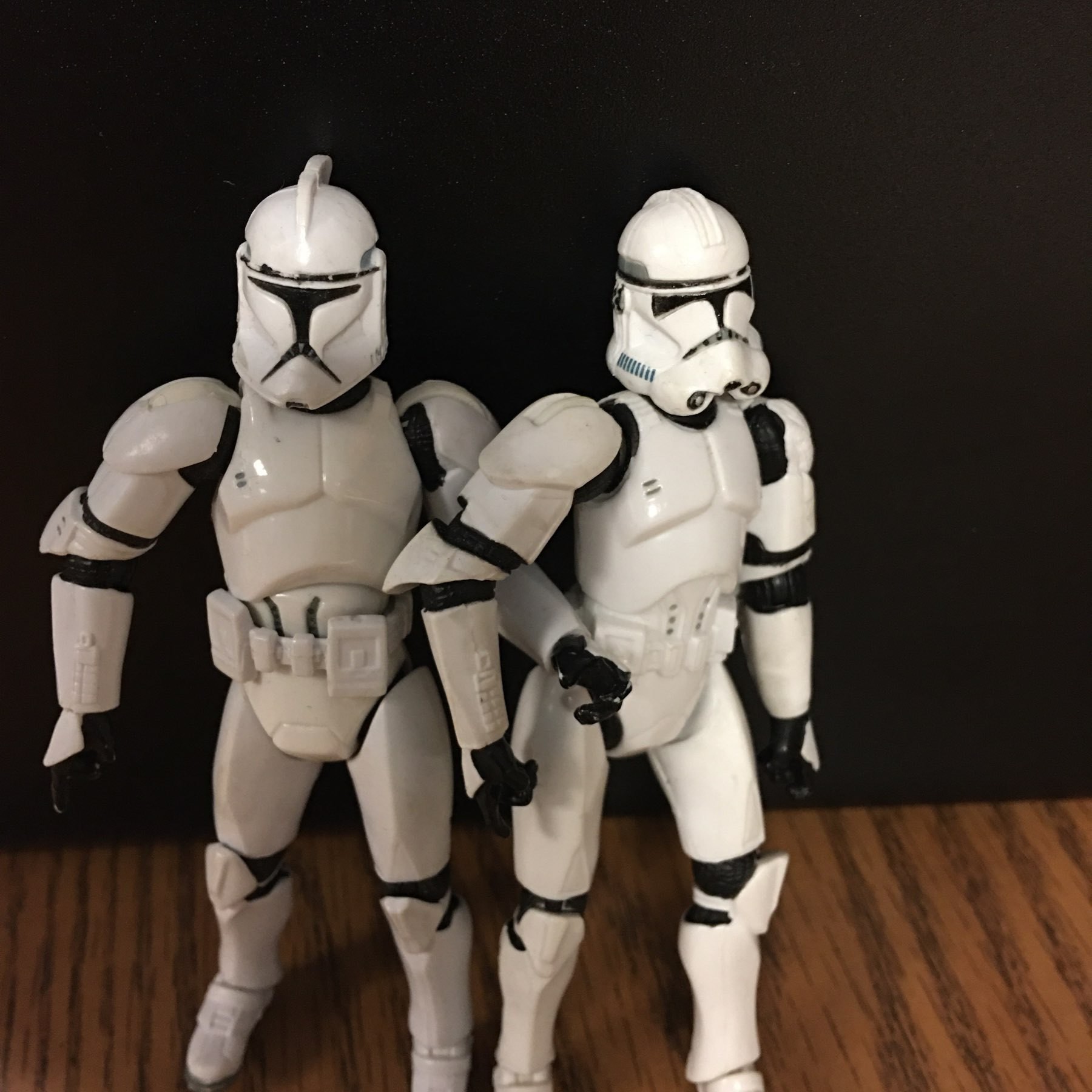 Two storm troopers holding hands. 