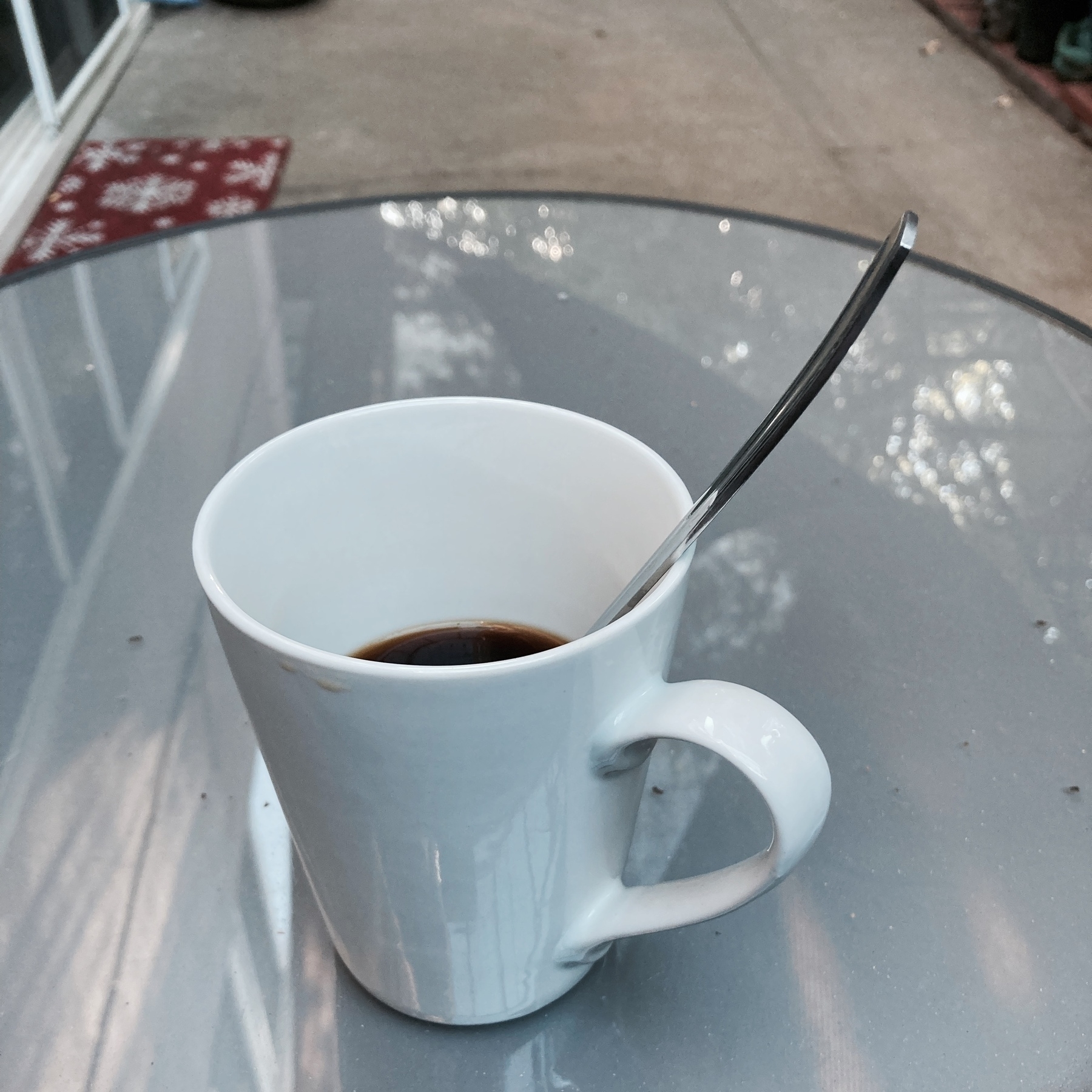 Coffee mug on patio table. 