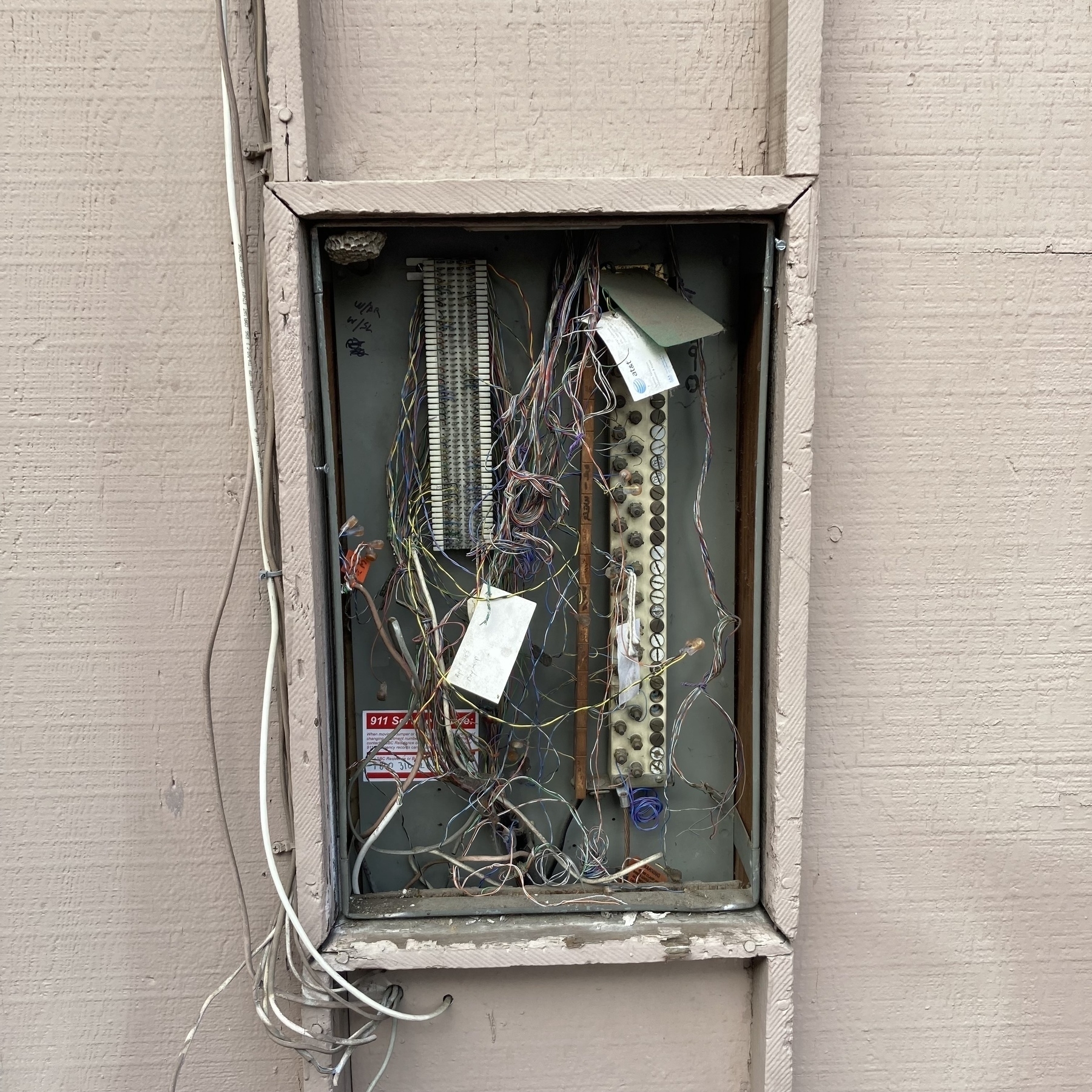 Phone wires exposed. 