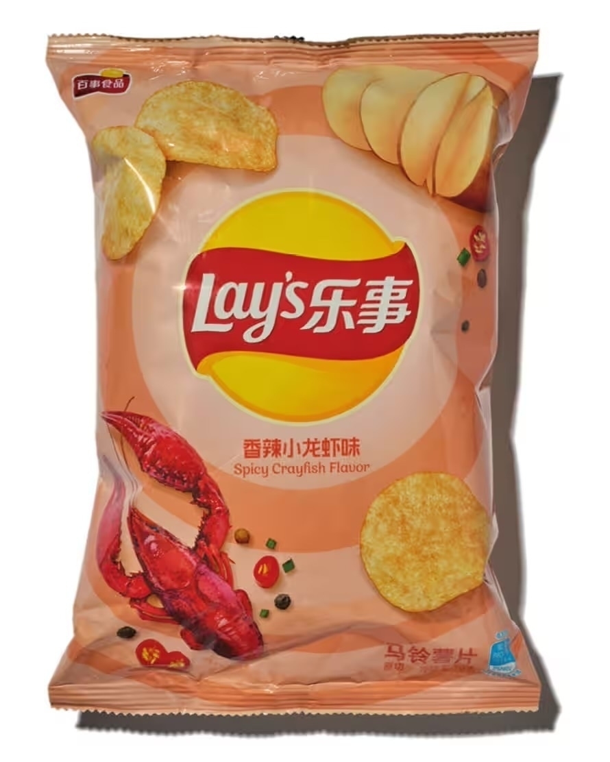 A packet of Lays chips/crisps that are spicy crayfish flavour. 