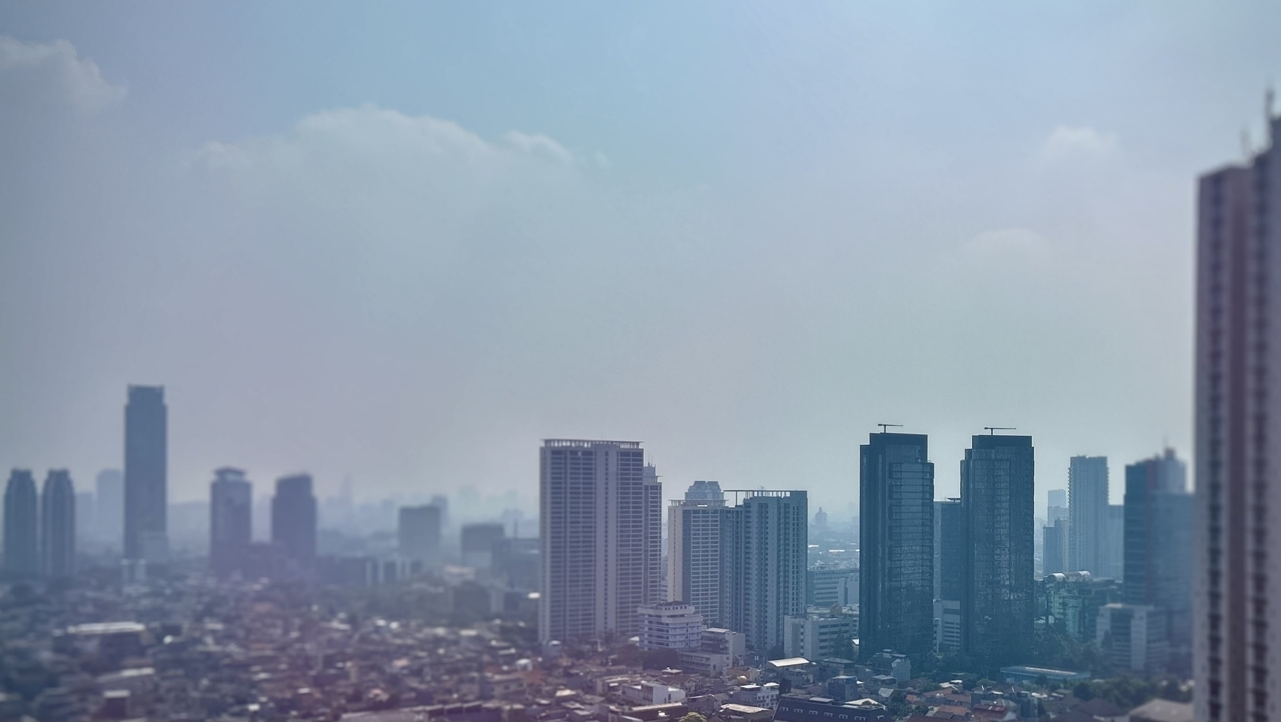A hazy skyline with high rise buildings 