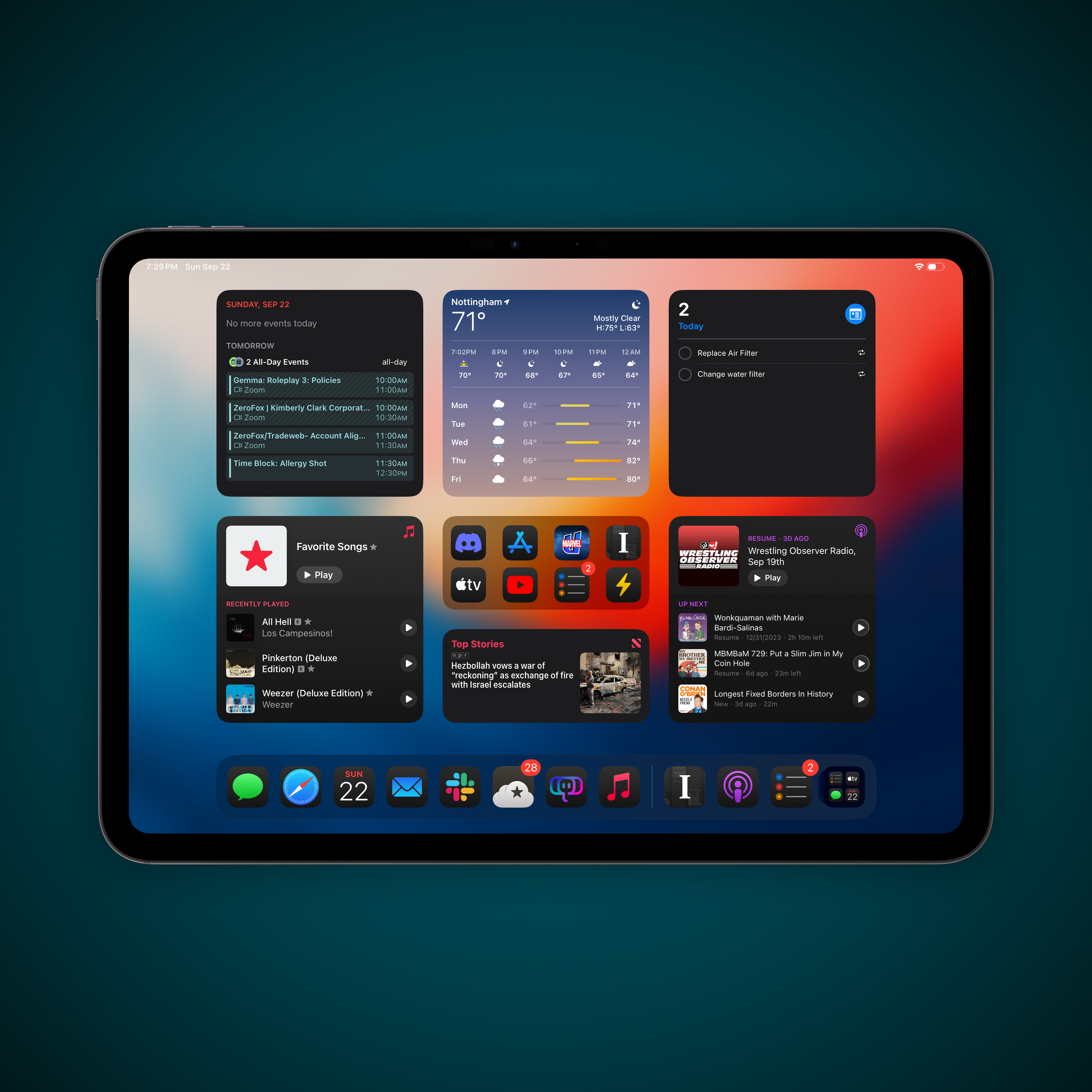 A tablet screen displays various app widgets and notifications against a colorful background.