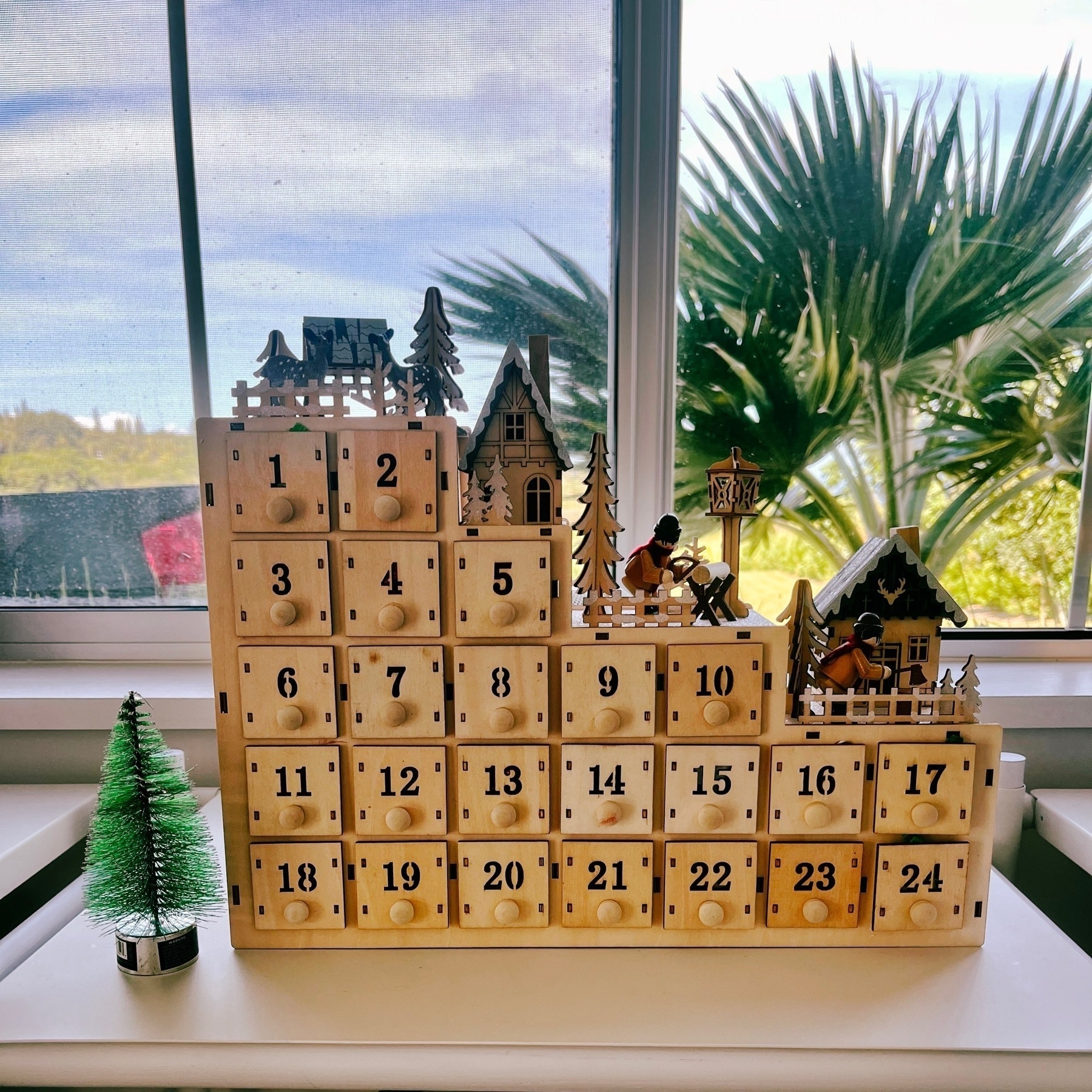 Wooden Advent Calendar with a draw of goodies for each day.