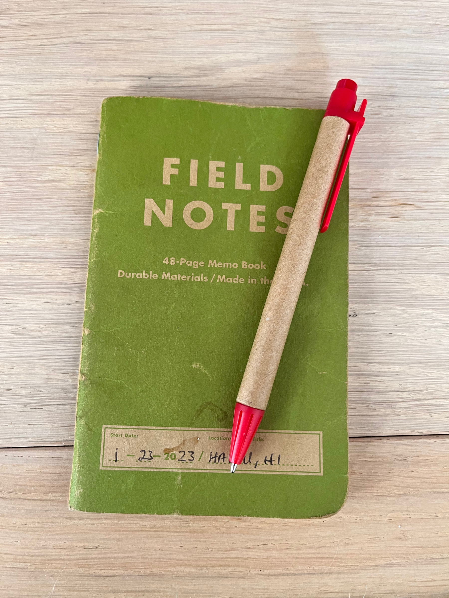 My current note book from Fieldnotes with a pen from Virgin Atlantic