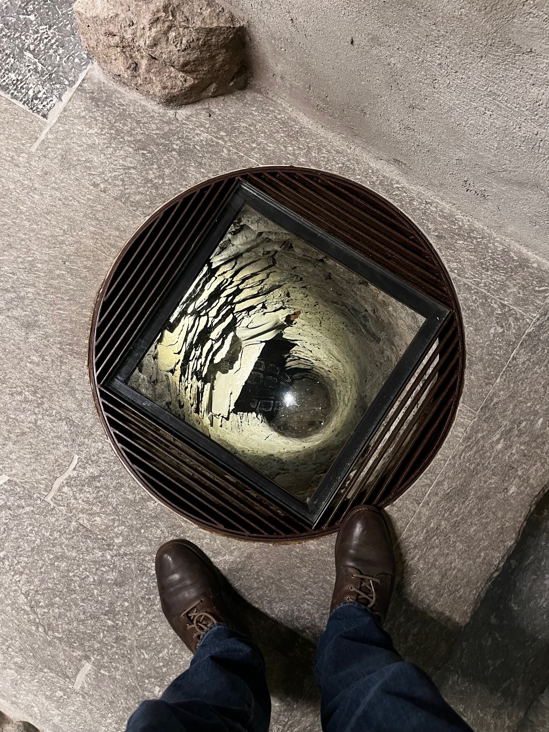 Standing above what might have been a well, now inside a hotel on Lake Como