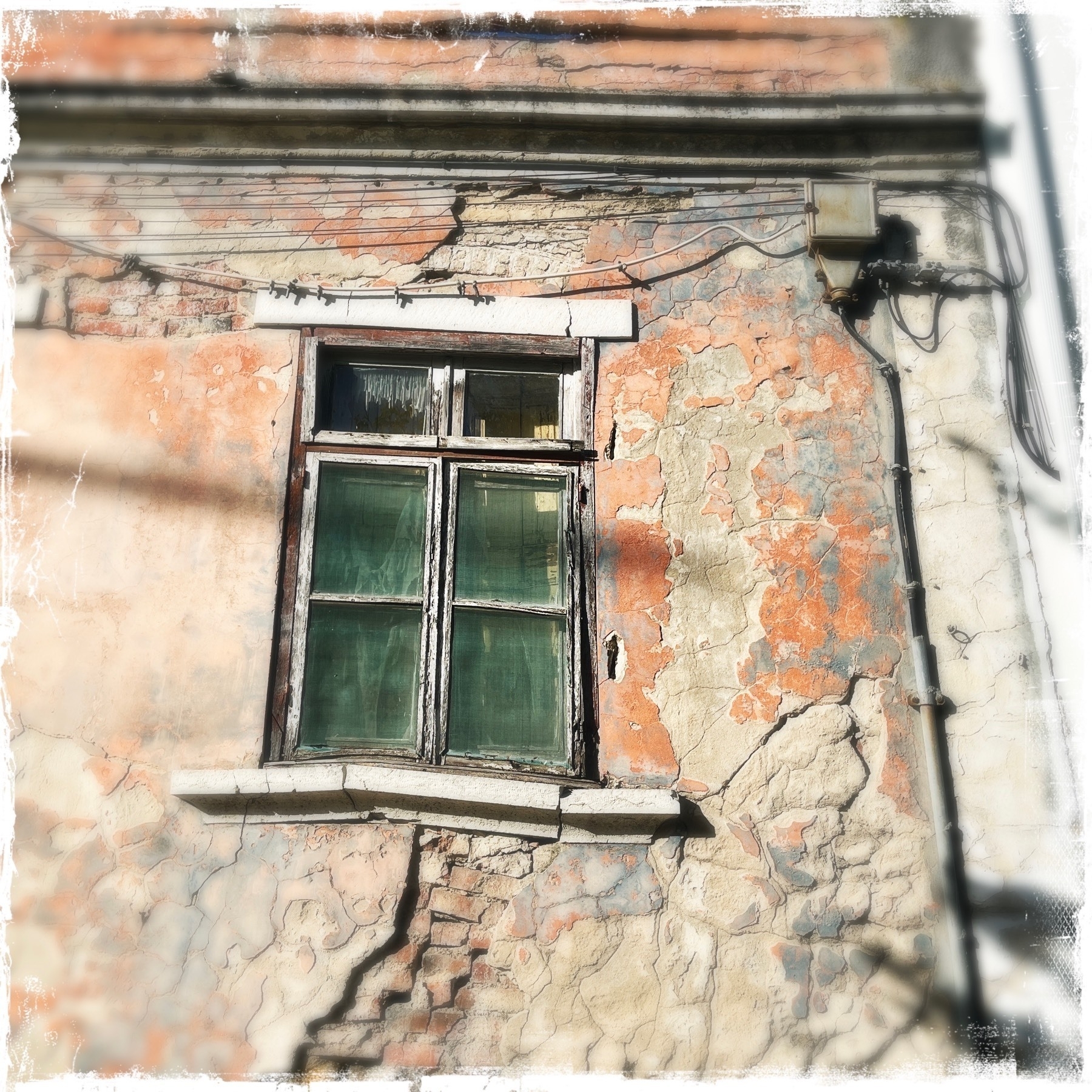 Wonky, ruined window on an old building 
