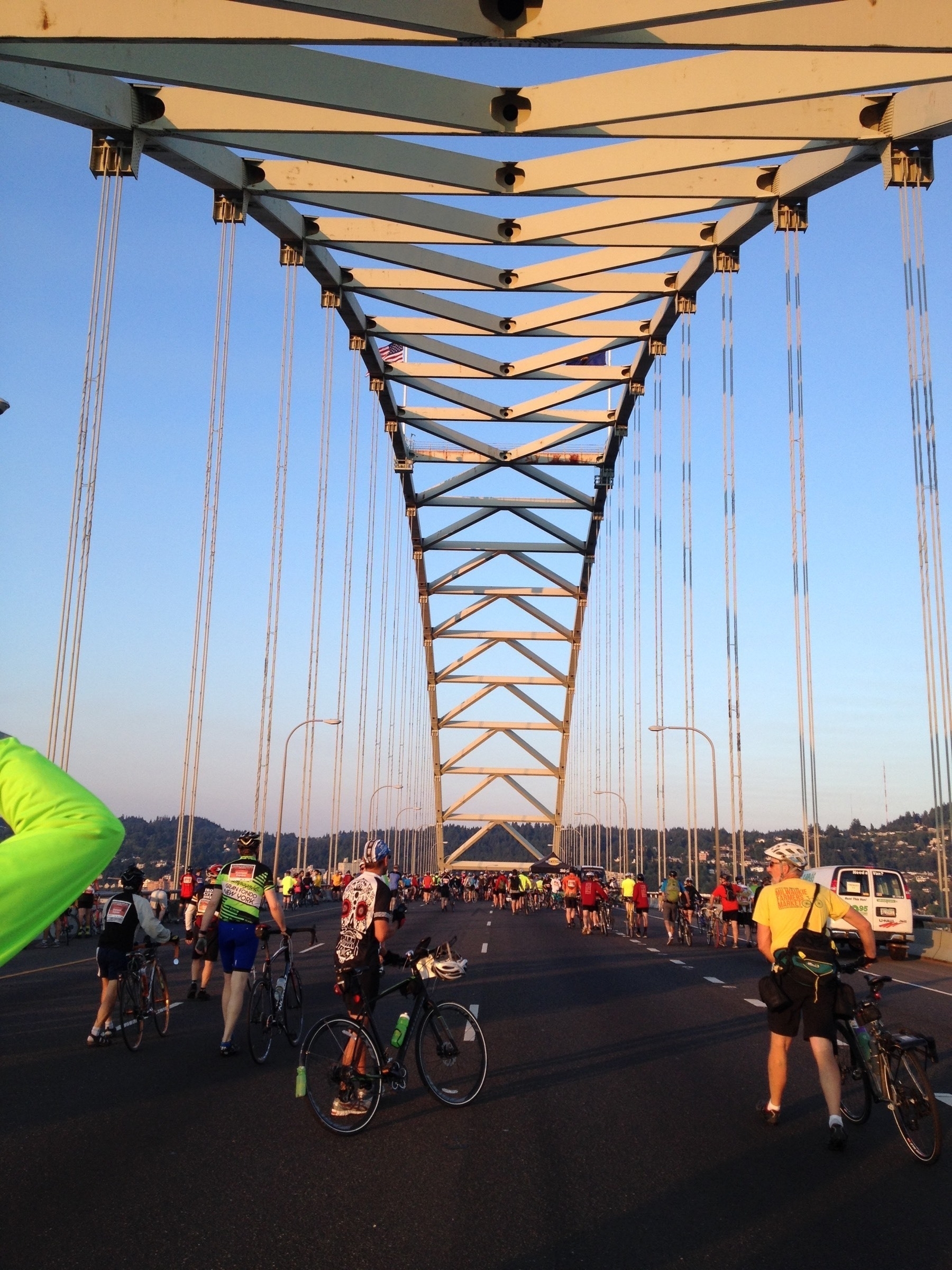 Cyclists stopping on the Fremont Bridge in Portland during the 2014 Providence Bridge Pedal, possibly at the start of the ride as it looks from the light as though the sun is just rising