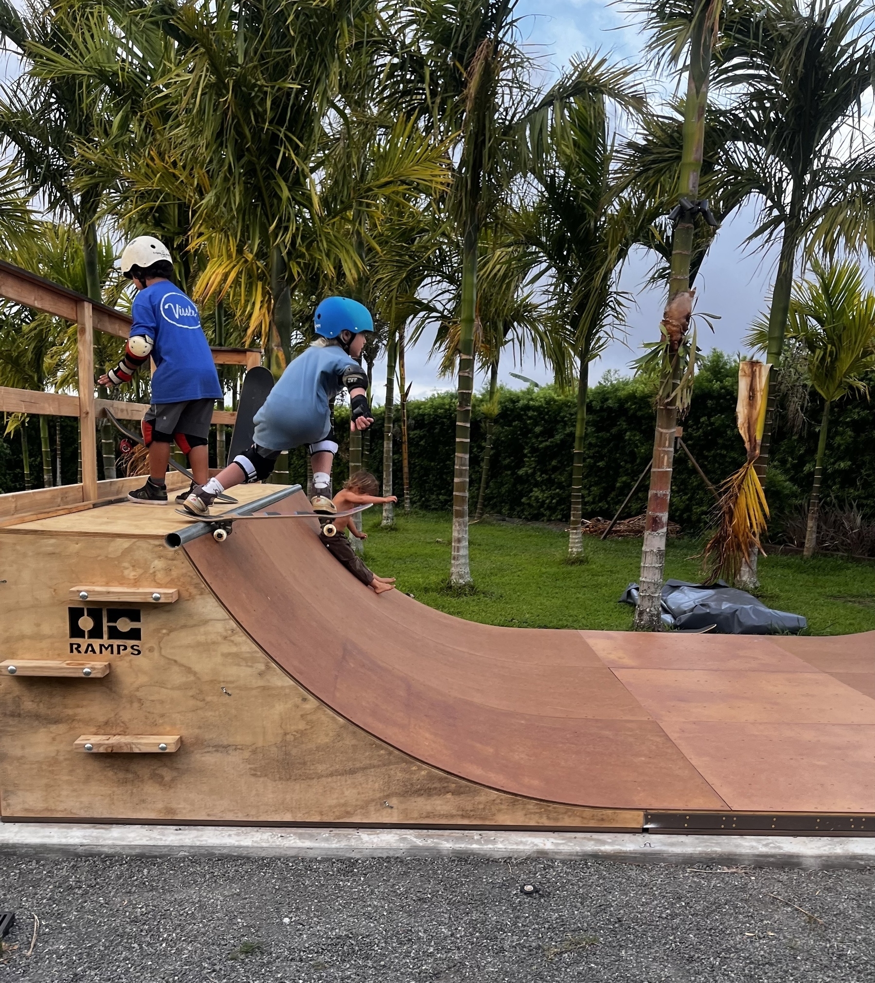 Kids on a skateboard half pipe