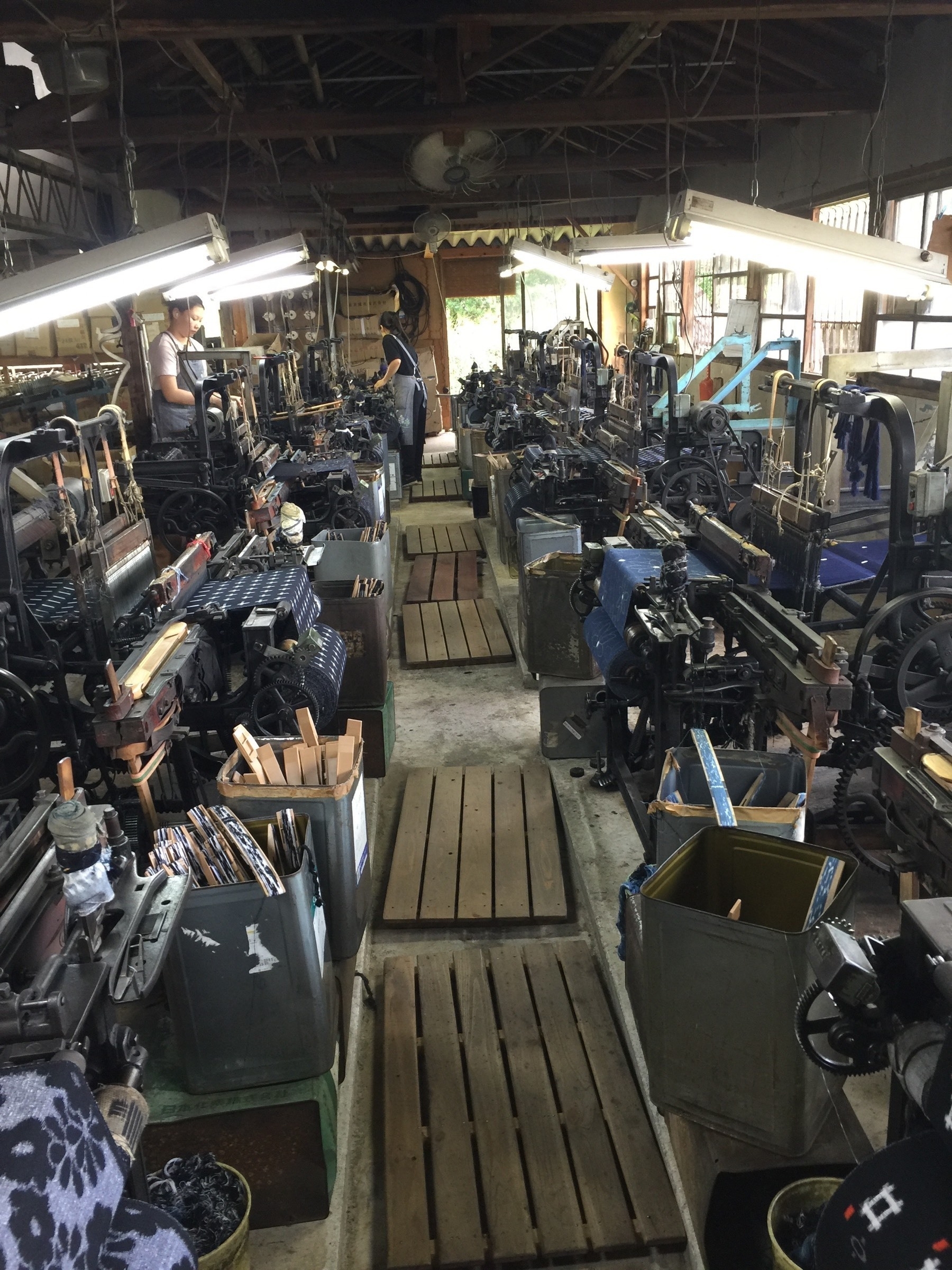 A small factory of mechanical looms, weaving indigo cloth, in Hirokawa, Japan