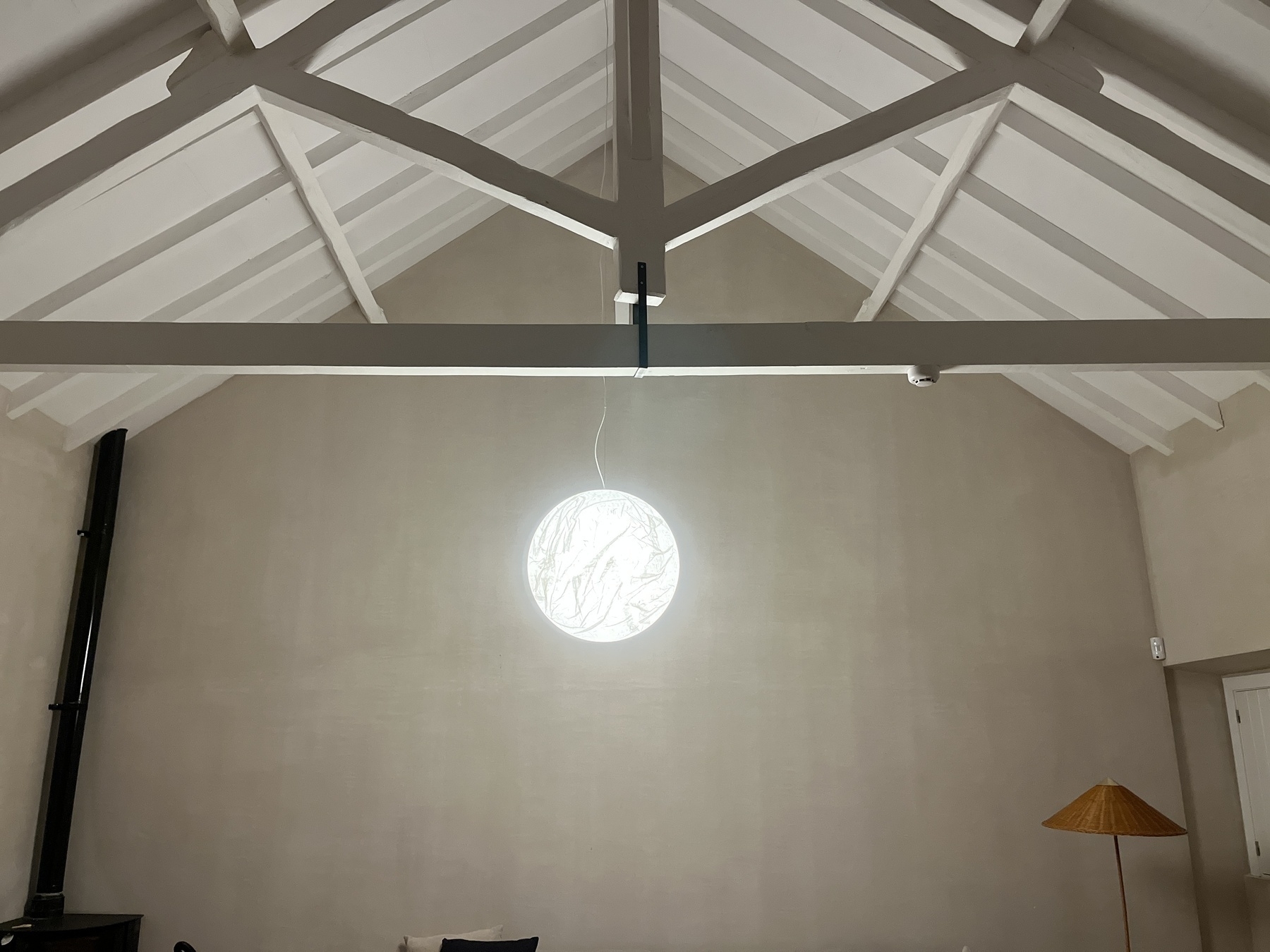 Davide Groppi moon lamp shade hanging in a house