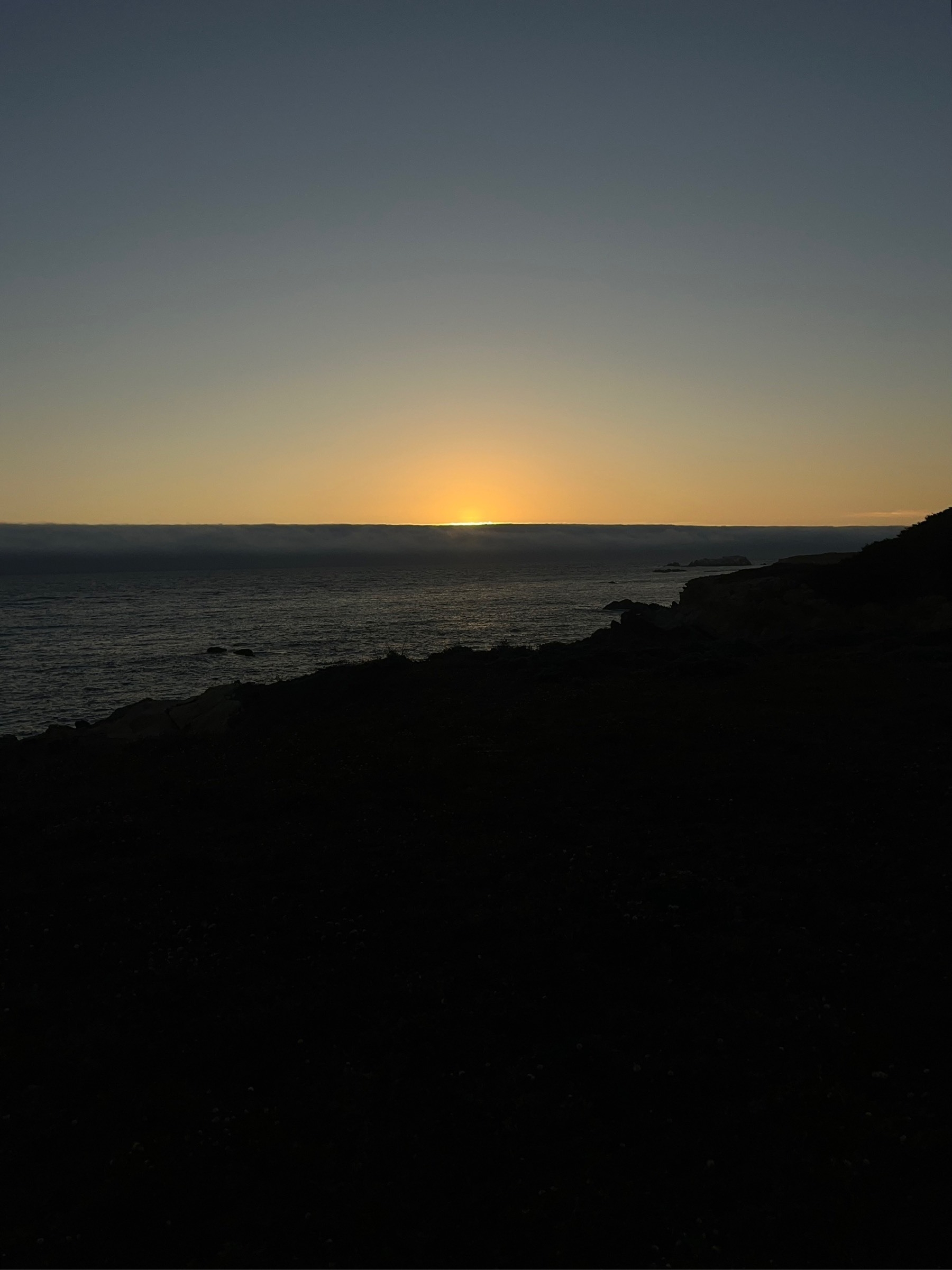 Sunset over the Pacific Ocean from the cliffs at Sea Ranch, California
