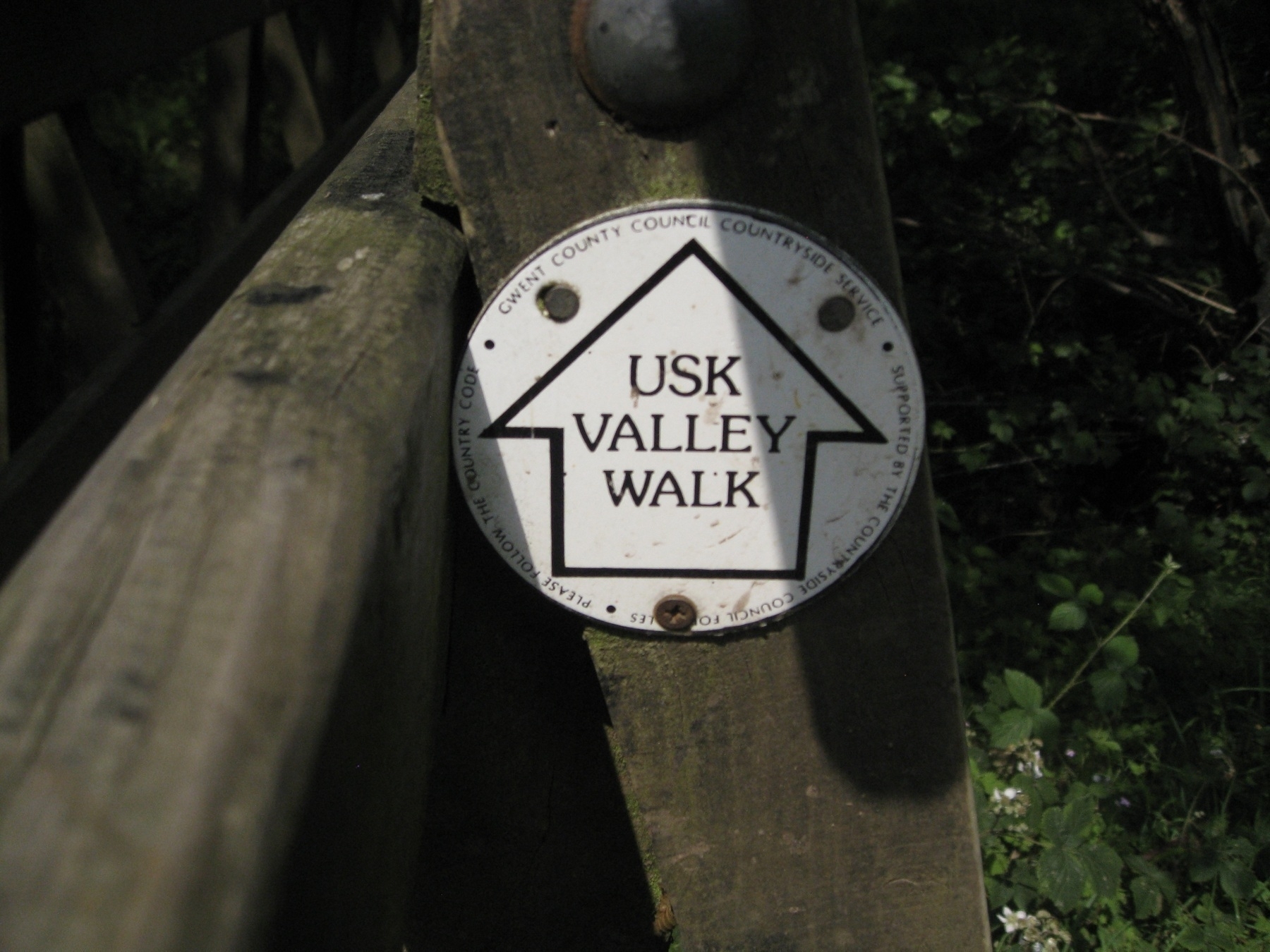 A sign on a post in South Wales pointing out the route for the Usk Valley Walk