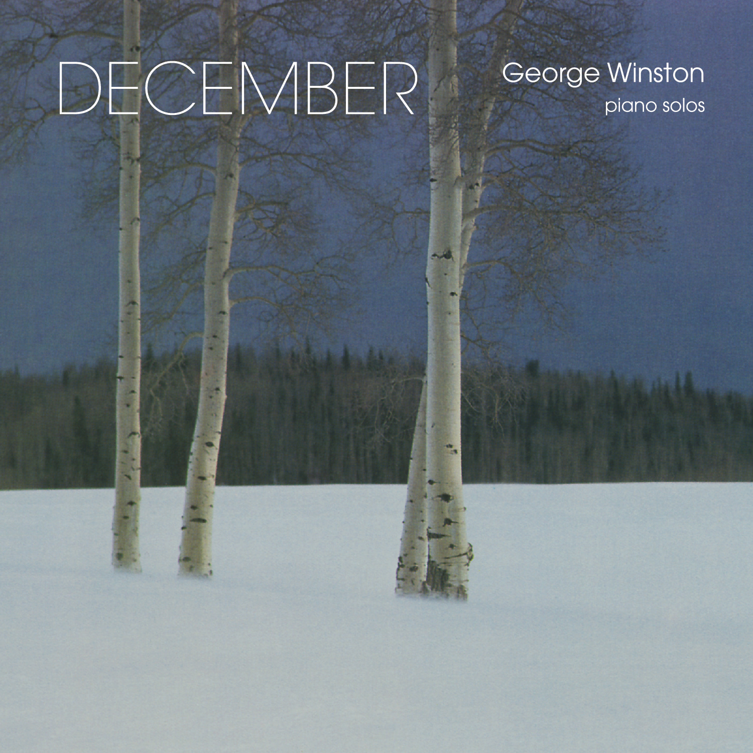 A snow-covered landscape with bare trees is featured on the album cover for “December” by George Winston, highlighting piano solos.