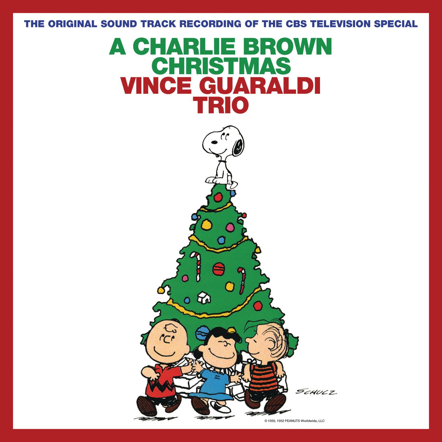 The album cover for the soundtrack to A Charlie Brown Christmas with Charlie Brown, Lucy and Linus dancing around a Christmas Tree, with Snoopy on the top.