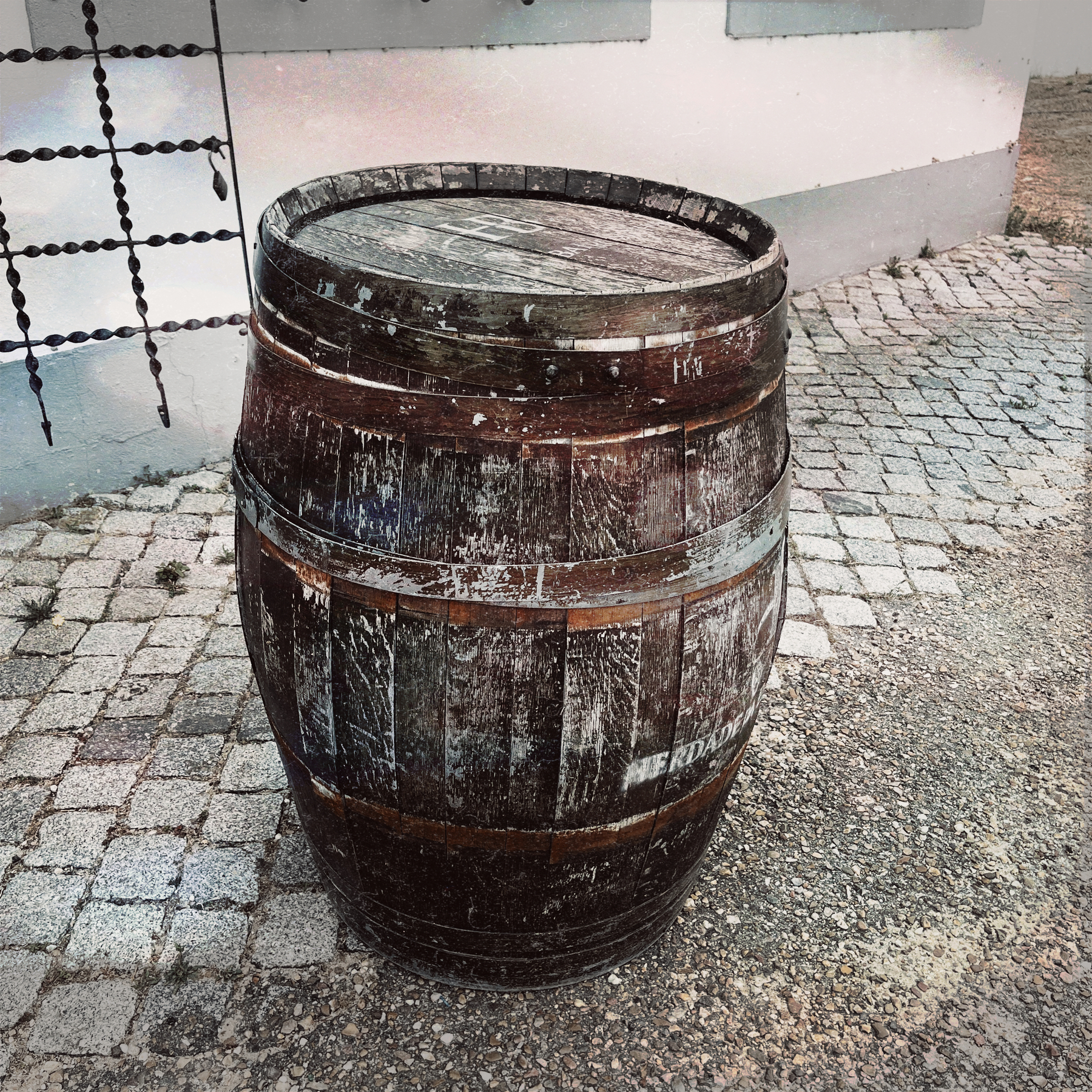 Barrel standing alone in a courtyard