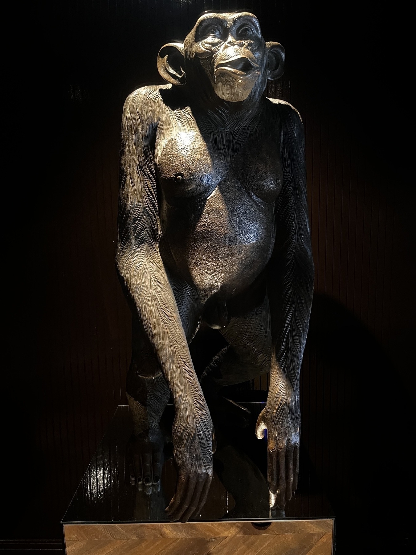 A full size statue of a chimpanzee