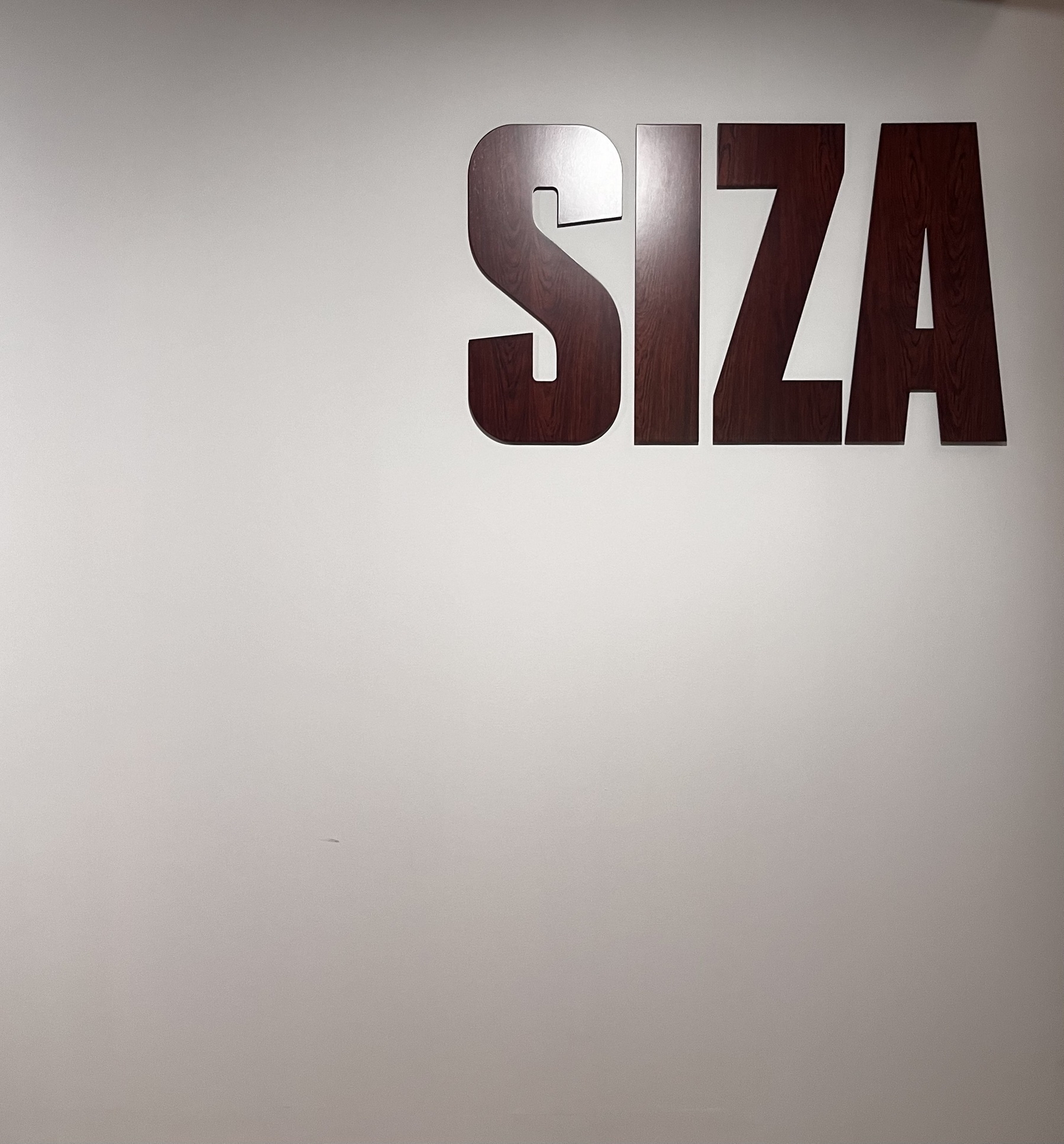 A white background with the name SIZA in capital letters